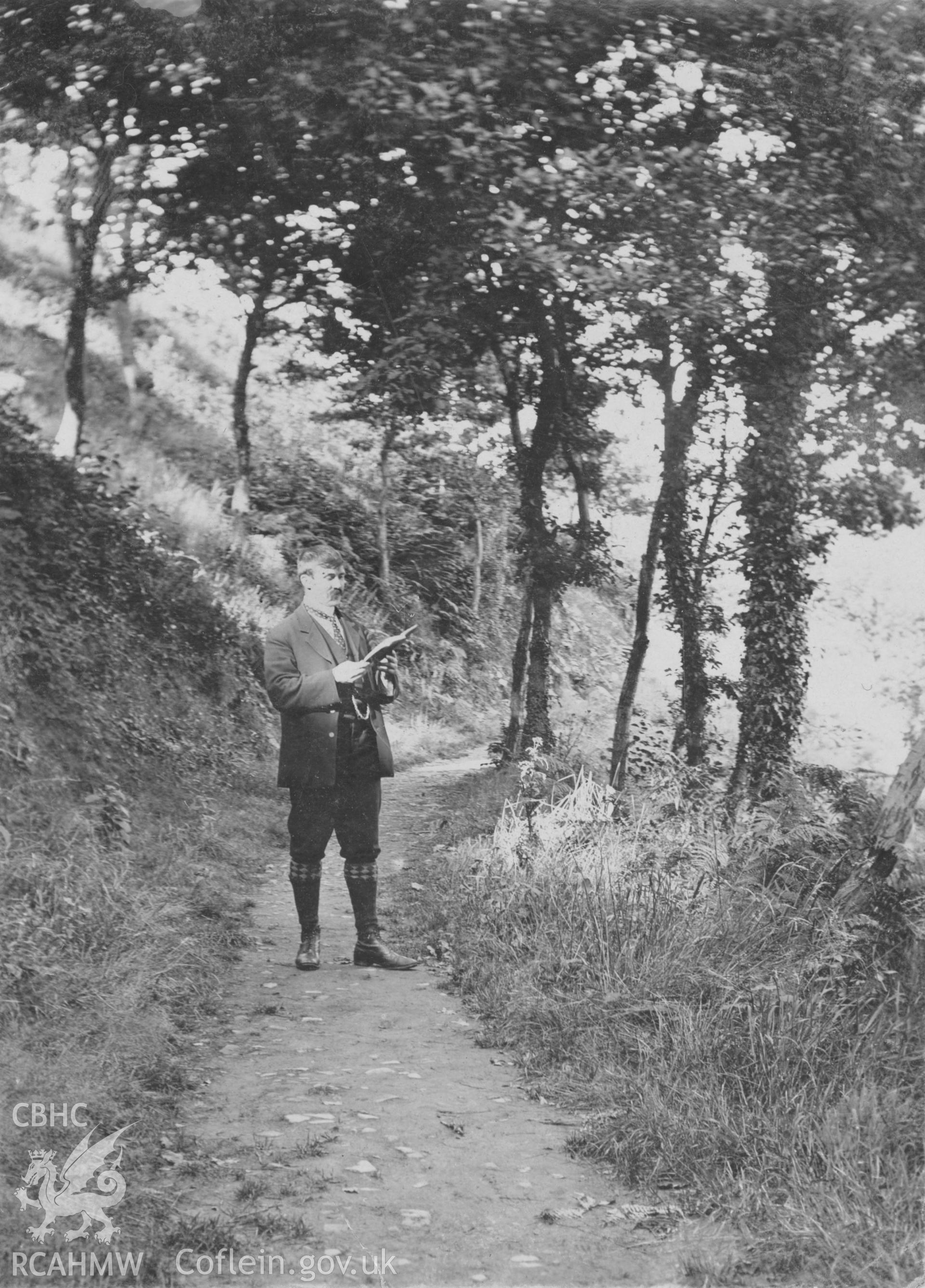 "By Llanelly Reservoir 1906". Photo of a standing figure.  Digitised from a photograph album showing views of Aberystwyth and District, produced by David John Saer, school teacher of Aberystwyth. Loaned for copying by Dr Alan Chamberlain.