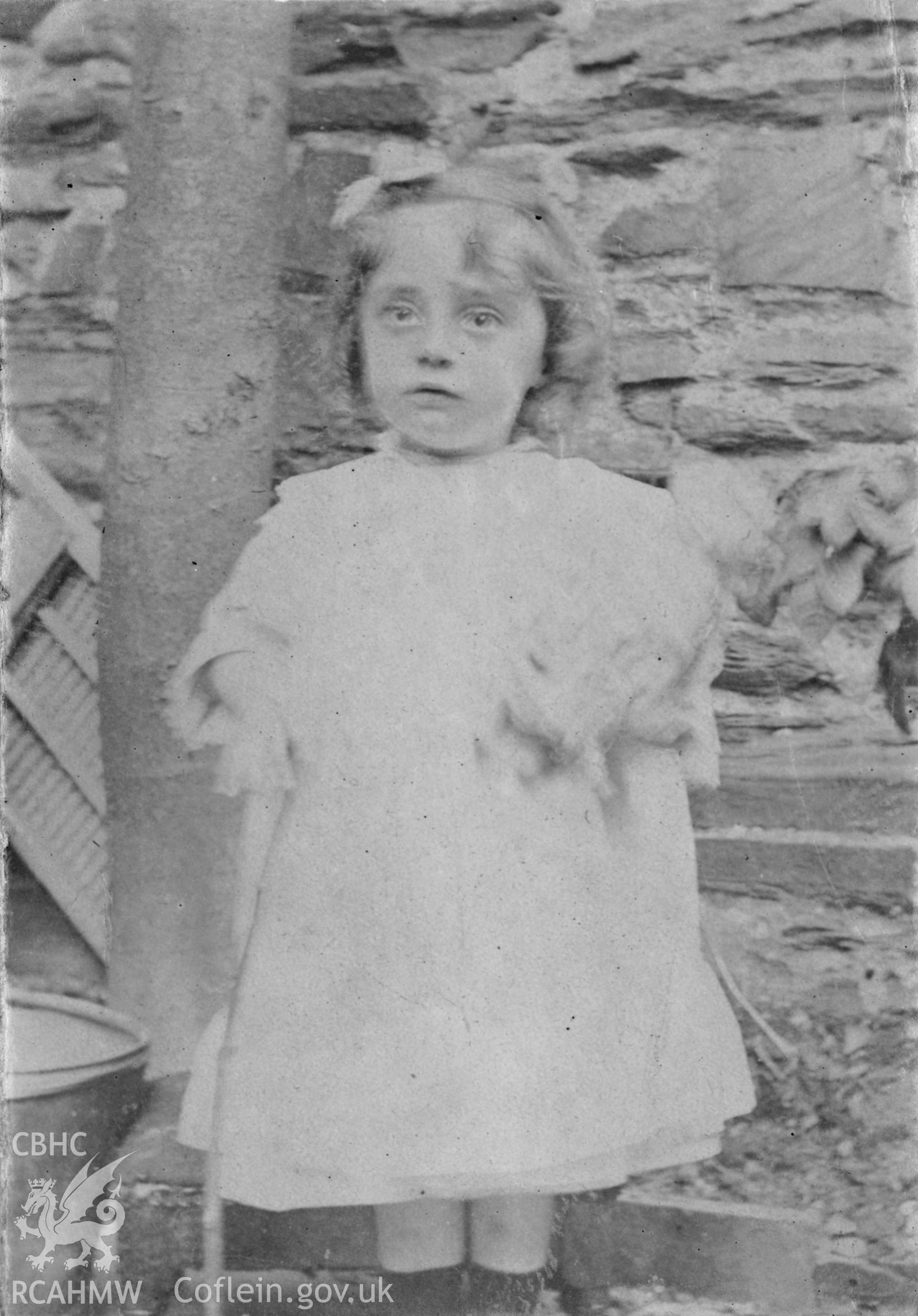 "1904". Photo of a standing child. Digitised from a photograph album showing views of Aberystwyth and District, produced by David John Saer, school teacher of Aberystwyth. Loaned for copying by Dr Alan Chamberlain.