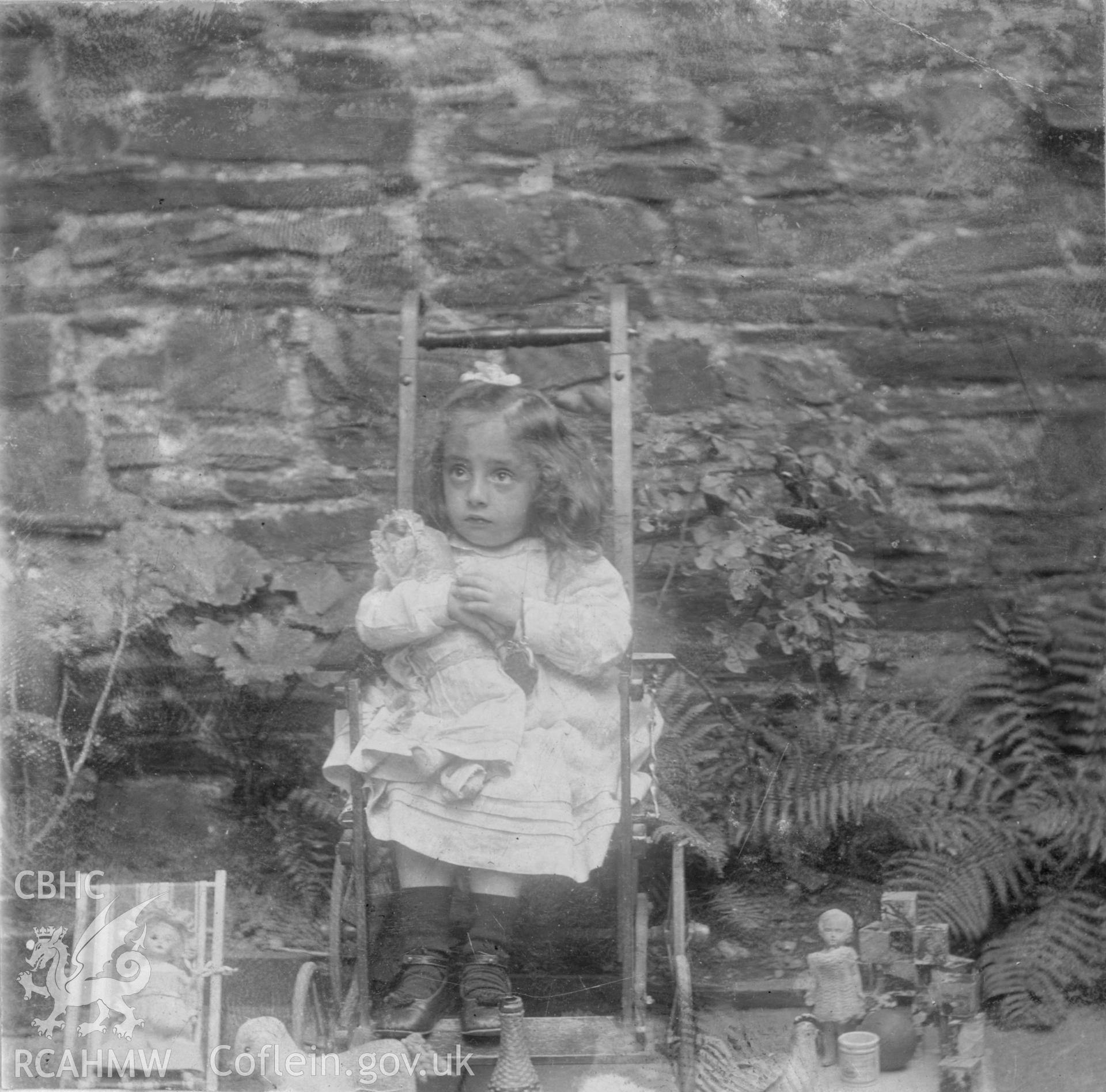 "In school garden 1904". Photo of a seated child. Digitised from a photograph album showing views of Aberystwyth and District, produced by David John Saer, school teacher of Aberystwyth. Loaned for copying by Dr Alan Chamberlain.