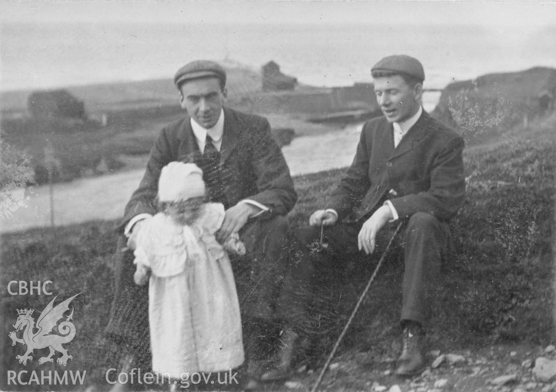 "Returning from Pen Dinas 1903". Photo of two adults and a small child. Digitised from a photograph album showing views of Aberystwyth and District, produced by David John Saer, school teacher of Aberystwyth. Loaned for copying by Dr Alan Chamberlain.