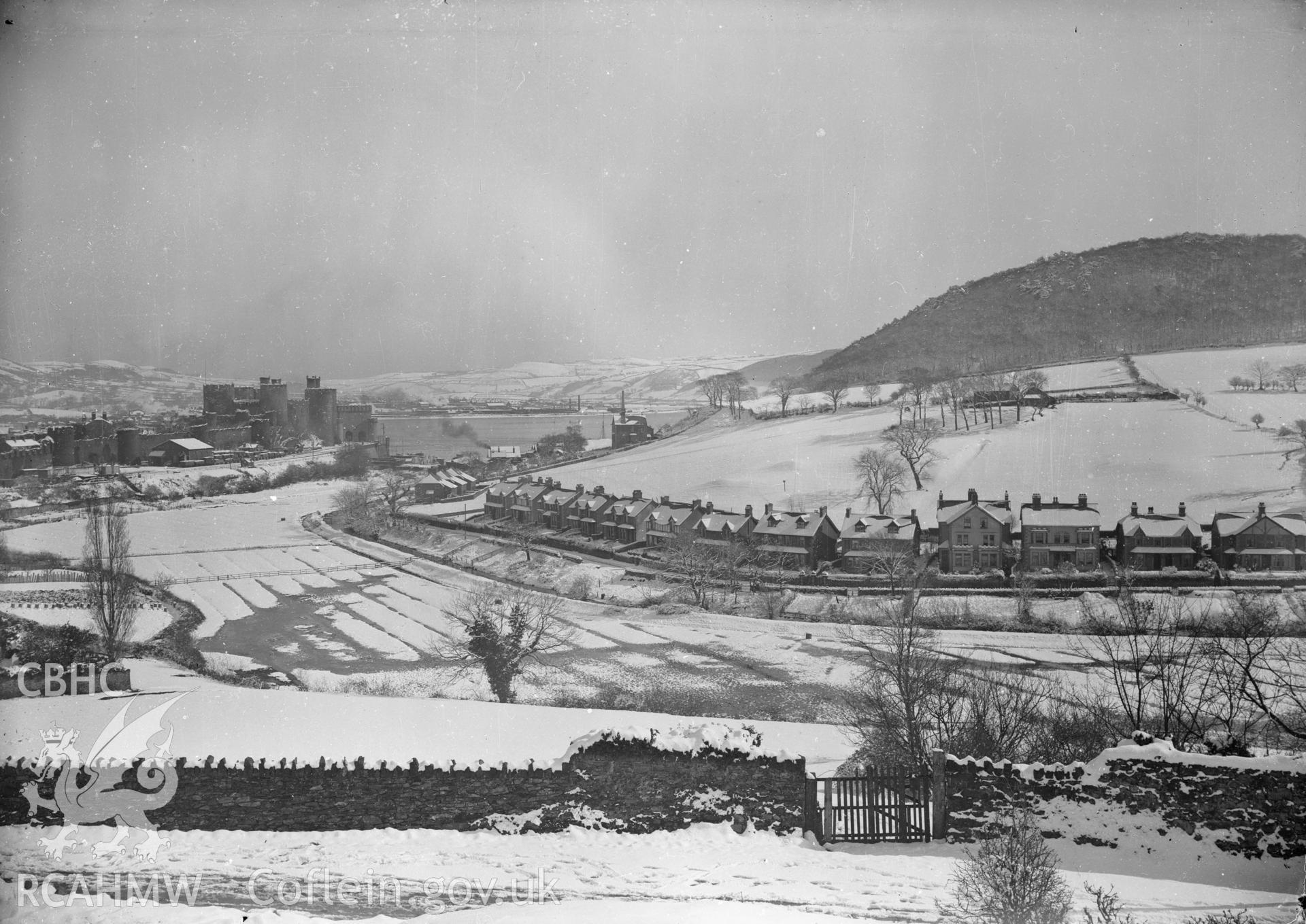 Black and white acetate negative, a copy of a glass plate showing Conwy coastline under snow.