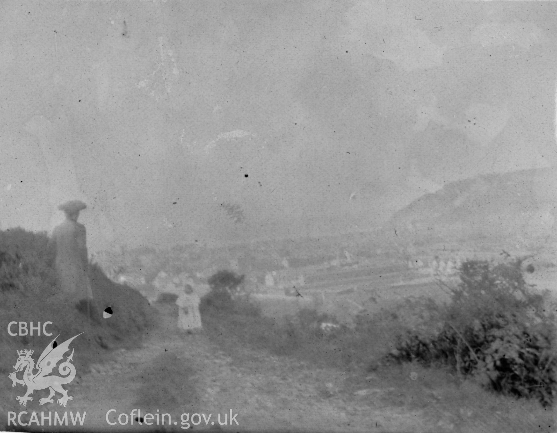 "Way up to Pen Dinas M +H 1904". Photo of two figures. Digitised from a photograph album showing views of Aberystwyth and District, produced by David John Saer, school teacher of Aberystwyth. Loaned for copying by Dr Alan Chamberlain.