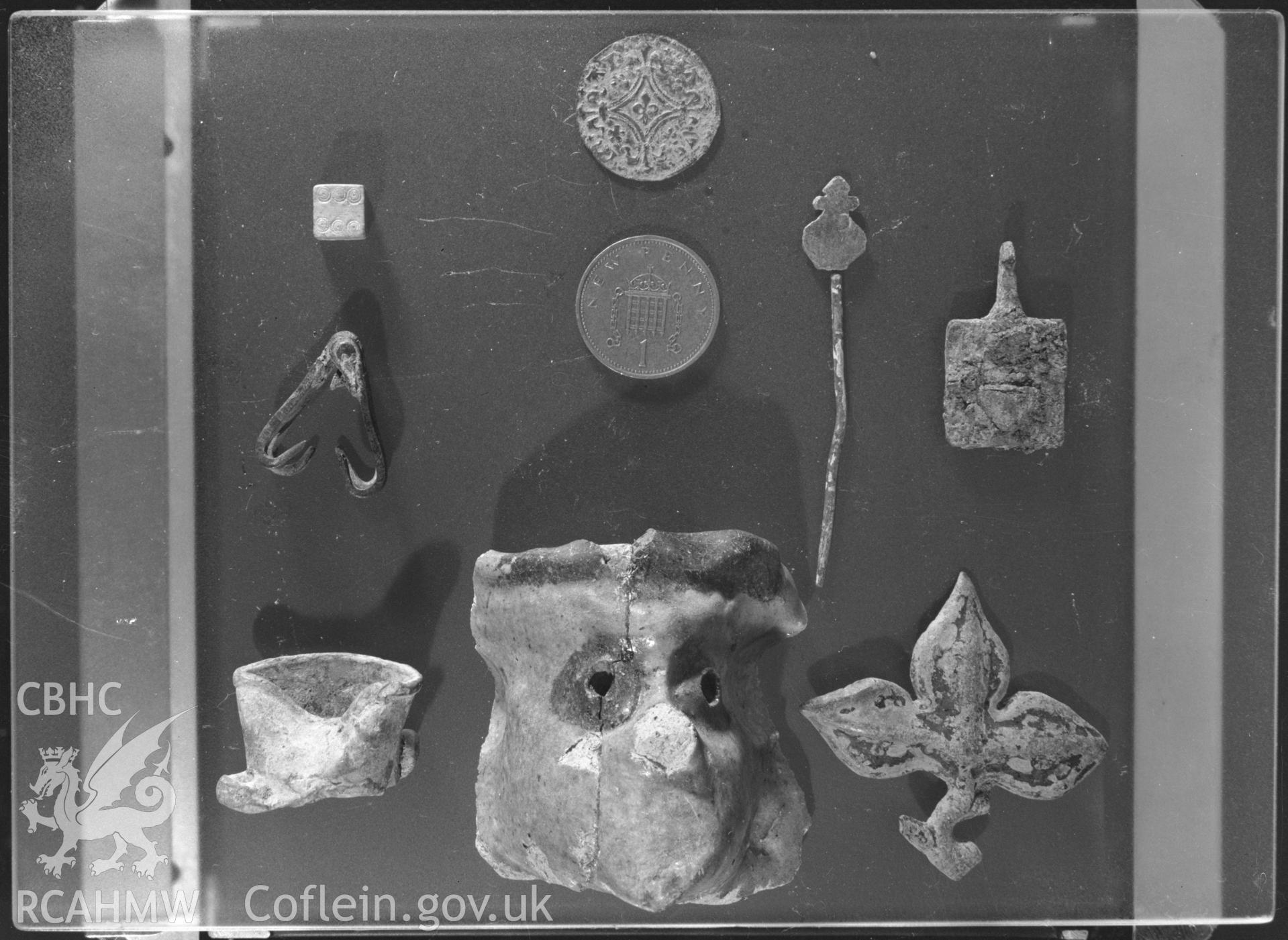 Black and white acetate negative showing finds from Aberystwyth Castle.