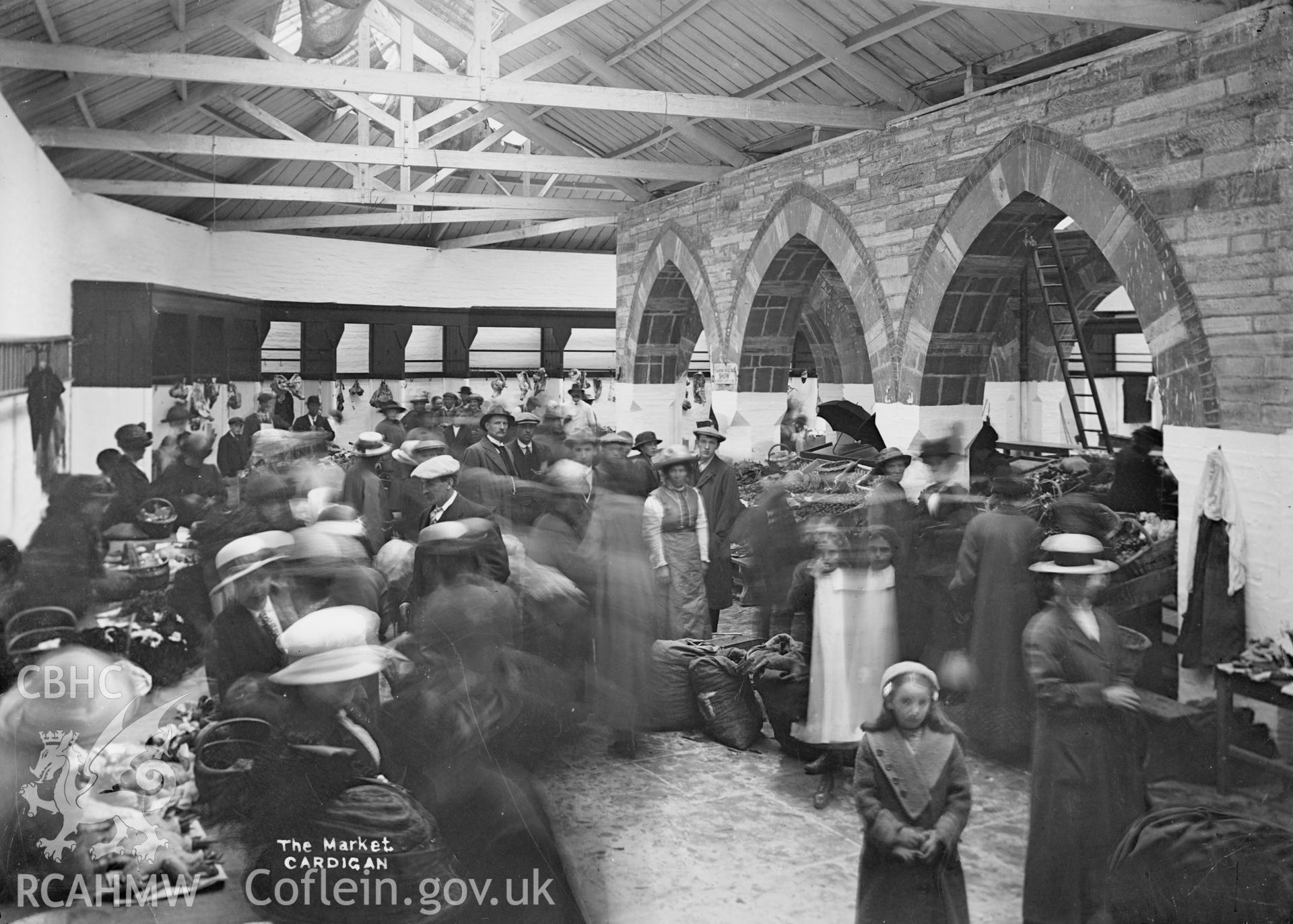 Black and white glass negative showing interior view of "The Market, Cardigan"