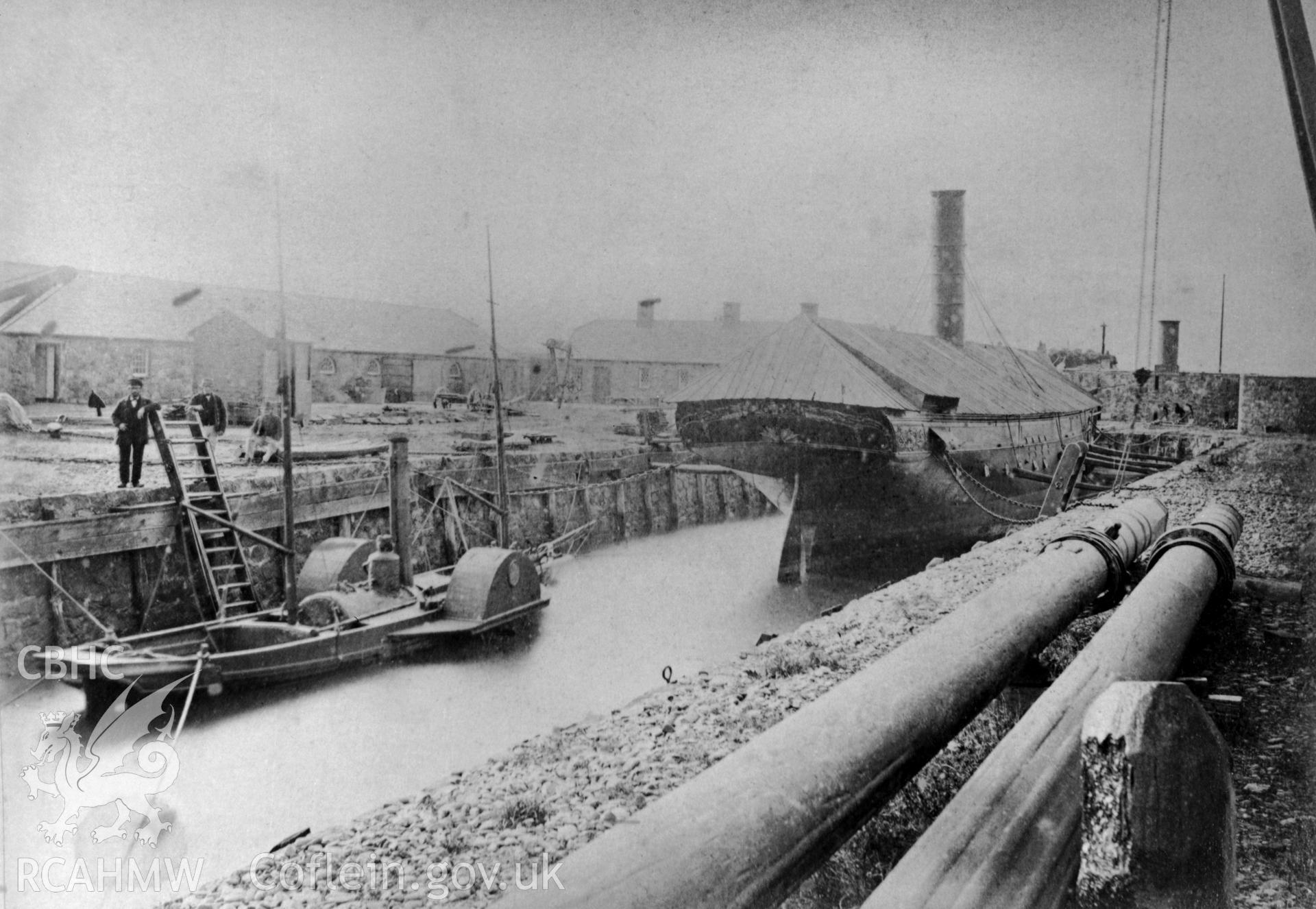 Fort Belan Dockyard with paddletug and steamship.