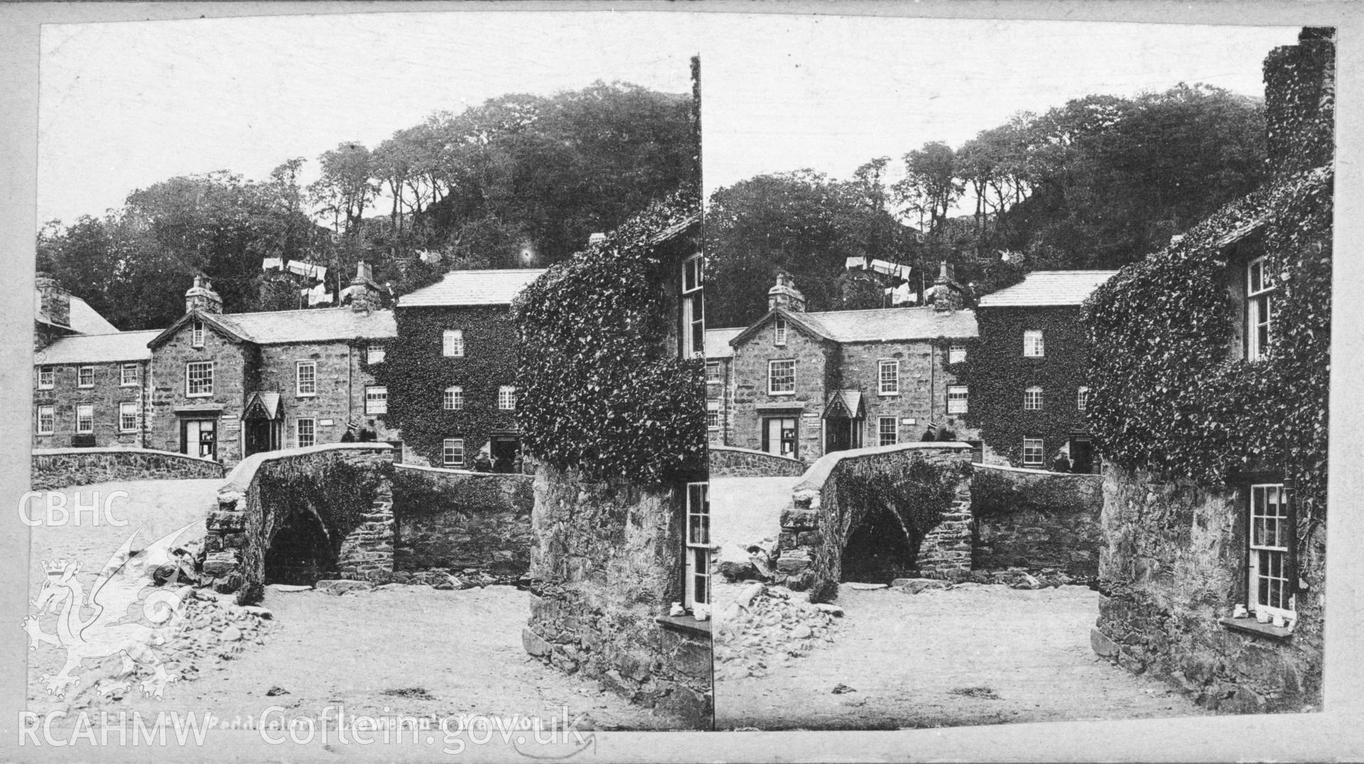 Black and white print of stereoscopic card of Beddgelert, showing a view of the bridge and "Llewelyn's Mansion". Copied from an original in the possession of Thomas Lloyd. Copy negative held.