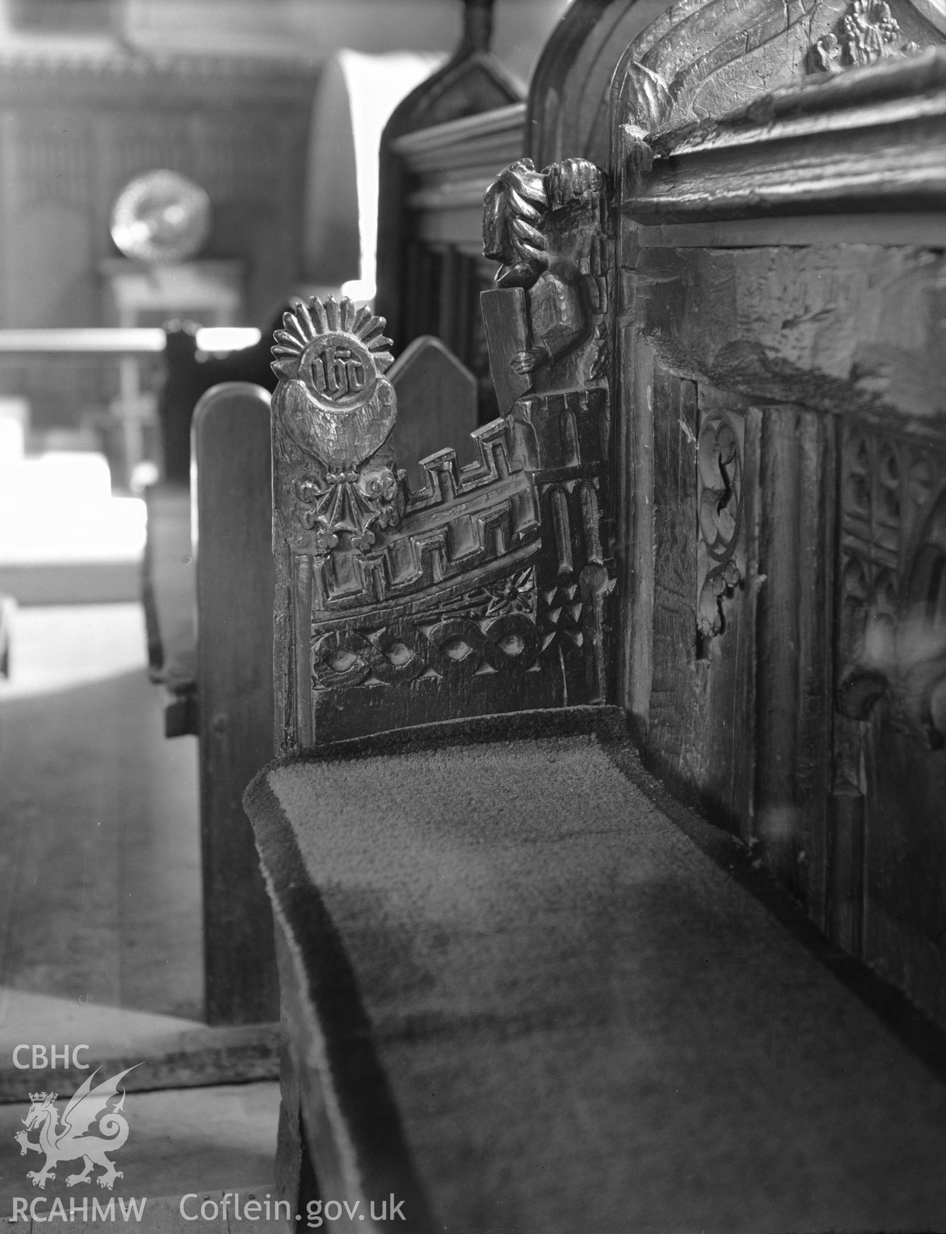 Interior view of St Marys Church Conwy showing bench end carvings, taken in 10.09.1951.