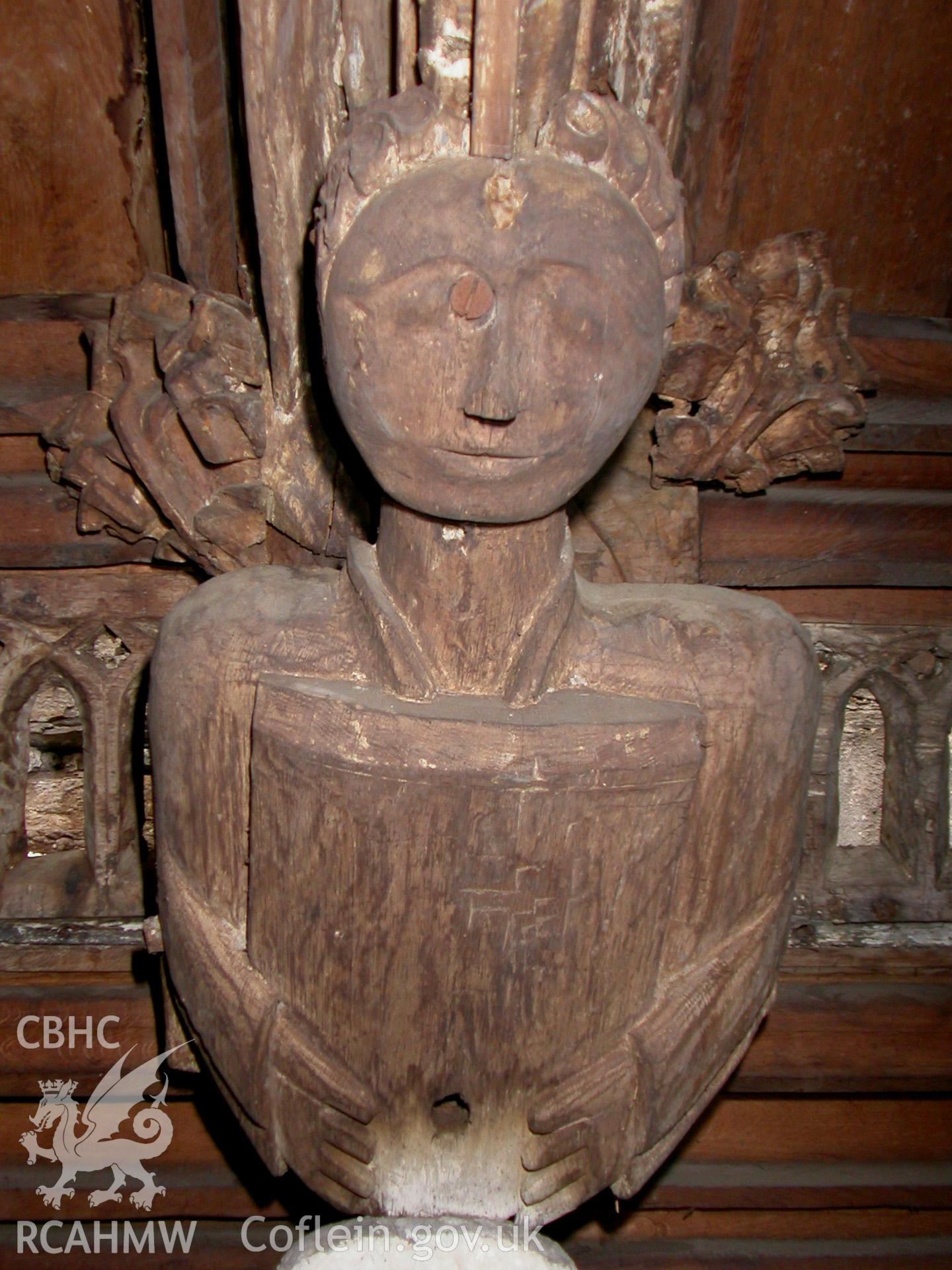 Carved wooden head between Trusses I & II, North side.