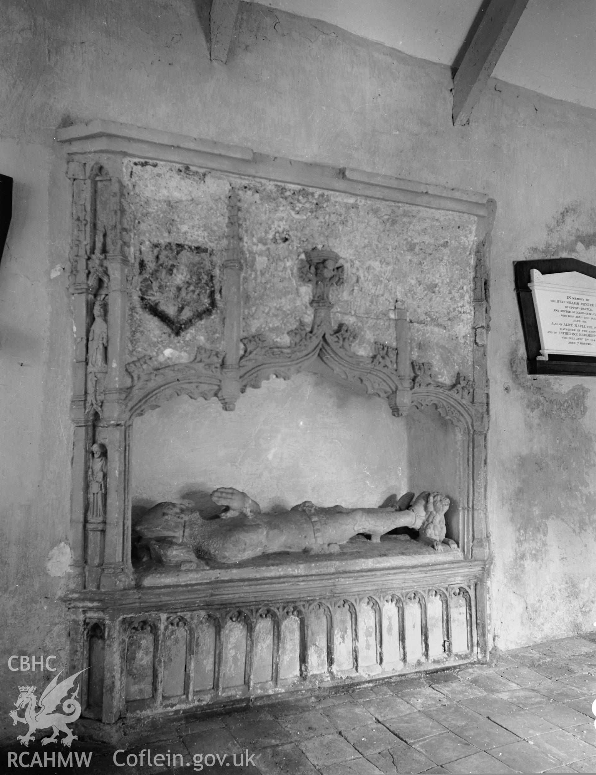 View of tomb recess and effigy of knight in the north side of the nave at Upton Church. Taken  03.09.1941. .