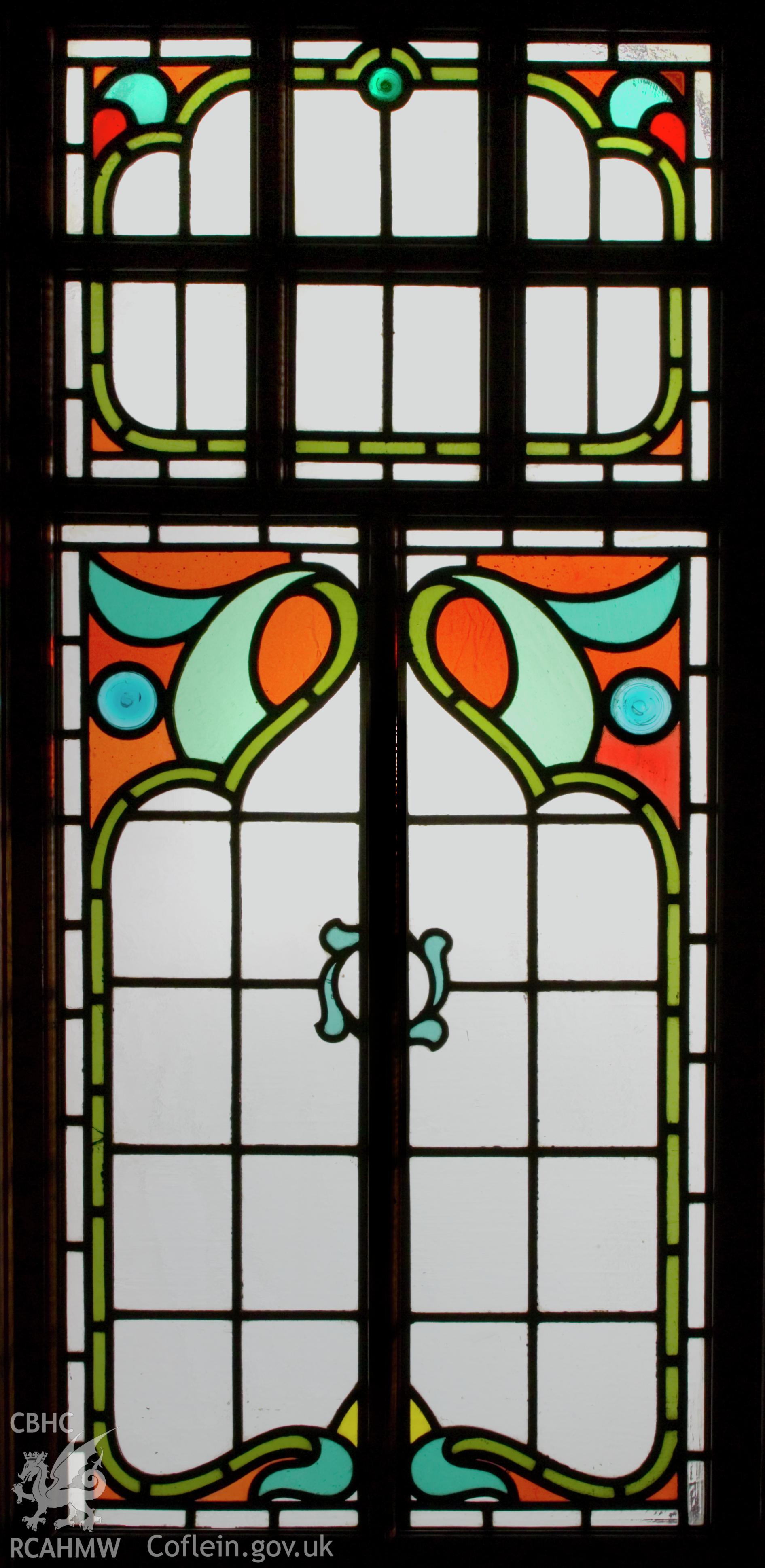 Section of rear stained glass screen, silhouette.
