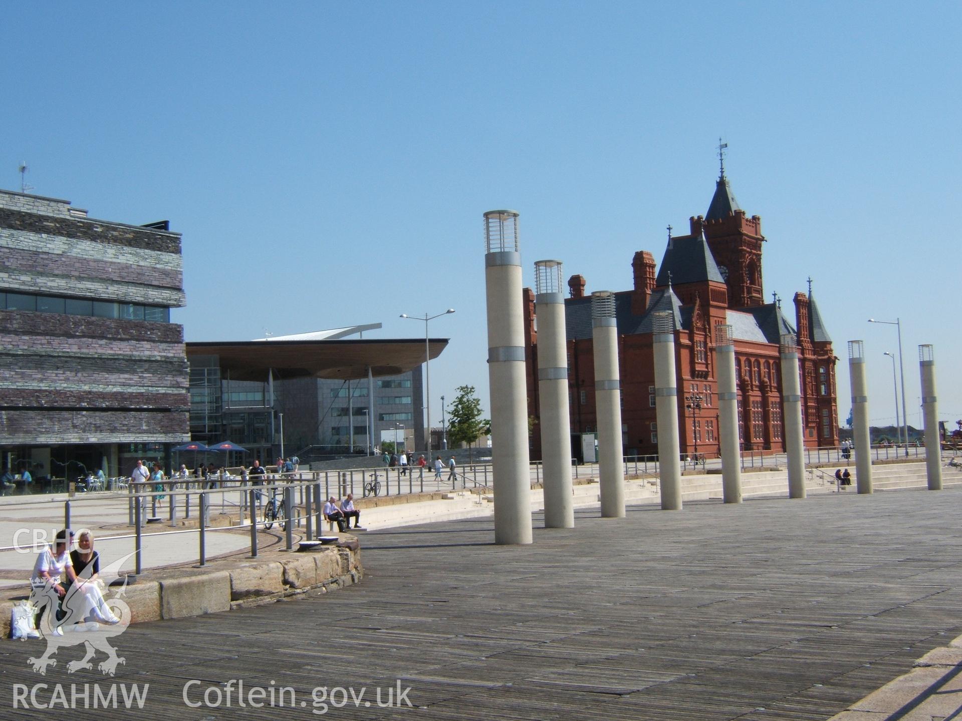 Pillars marking west side of former dock basin with centre to the east (left) & Senedd & Pierhead Building beyond.