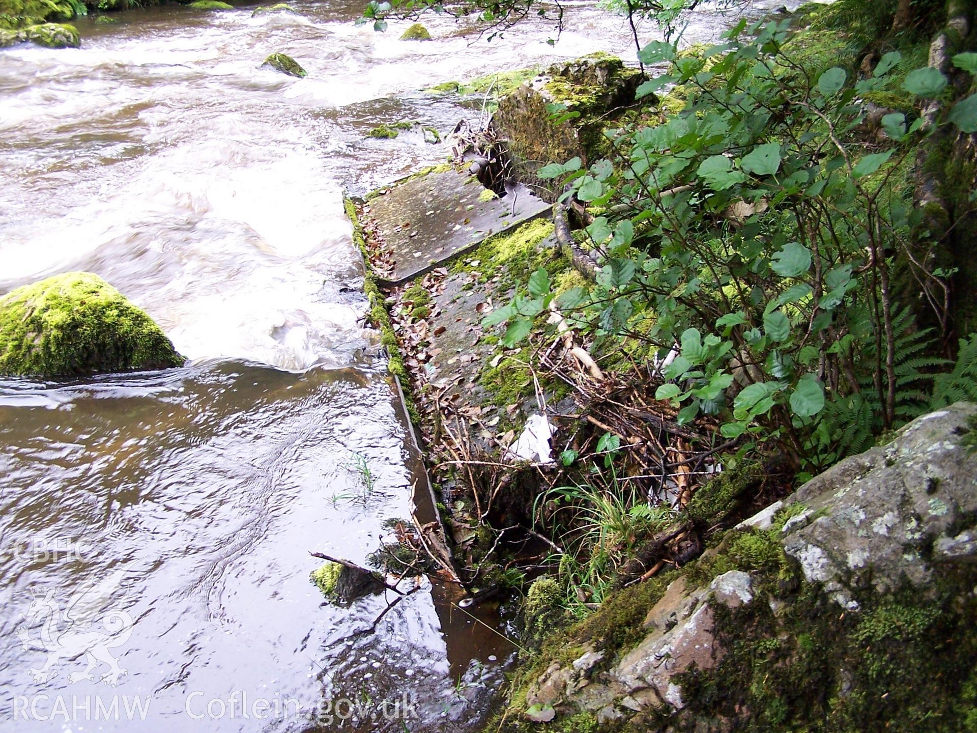 Upper aqueduct (NPRN:405083), remains of trough on river bank.