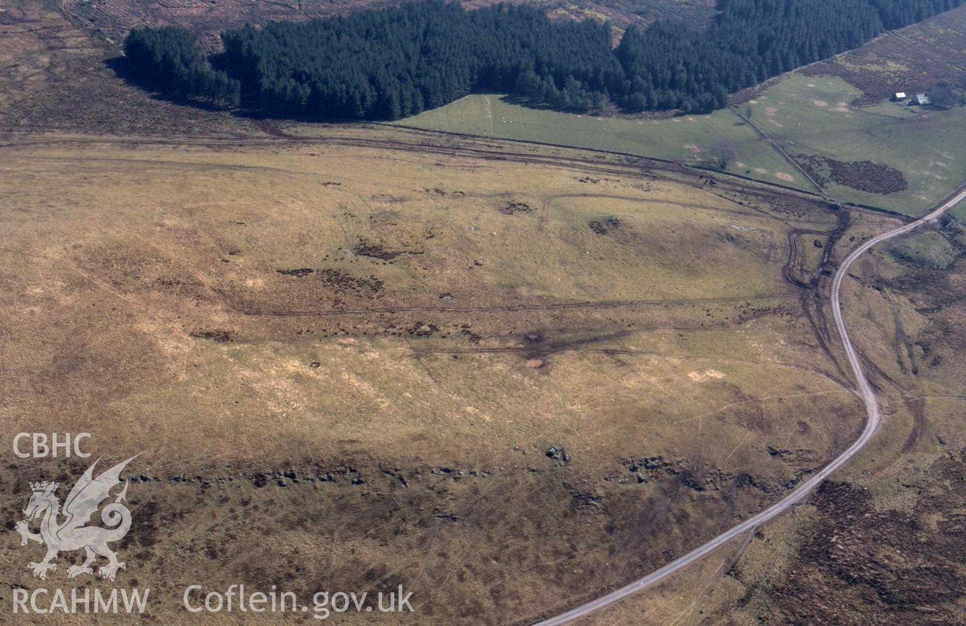 RCAHMW colour oblique aerial photograph of Mynydd Bach Cairnfield. Taken by C R Musson on 23/03/1995