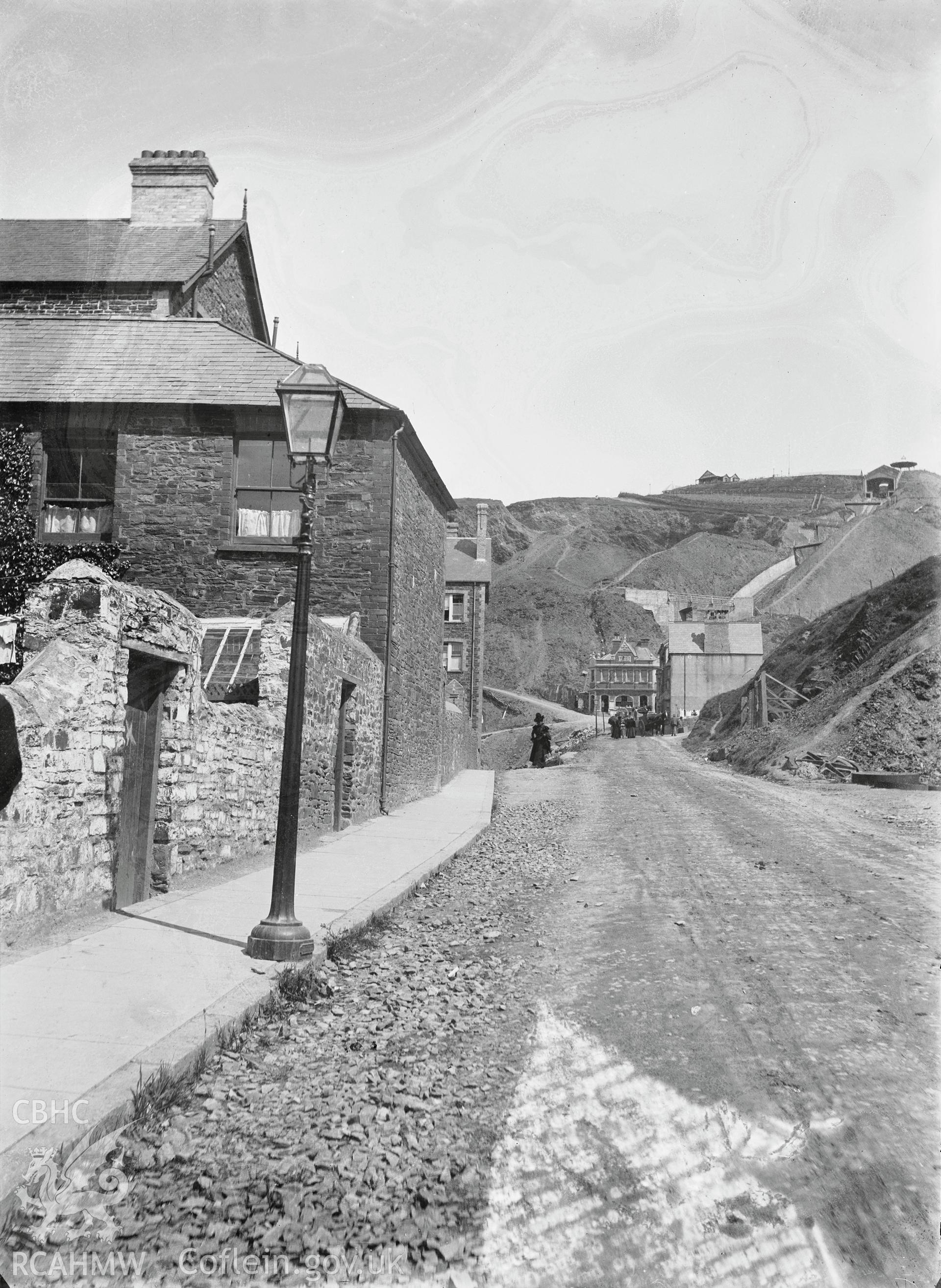 Black and white image dating from c.1910 showing view along Queens Road towards Constitution Hill,  taken by Emile T. Evans.