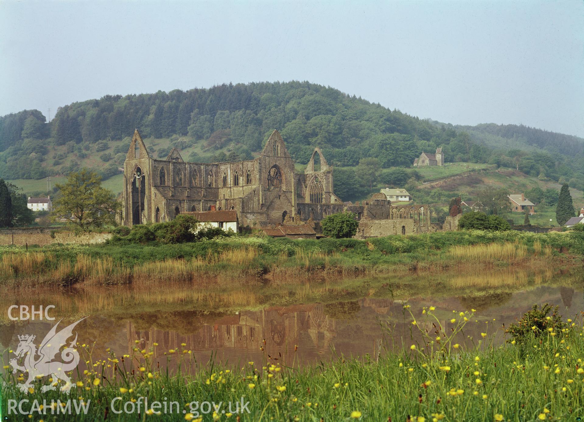 D.O.E. colour transparency of Tintern Abbey: exterior view, taken from across the river.