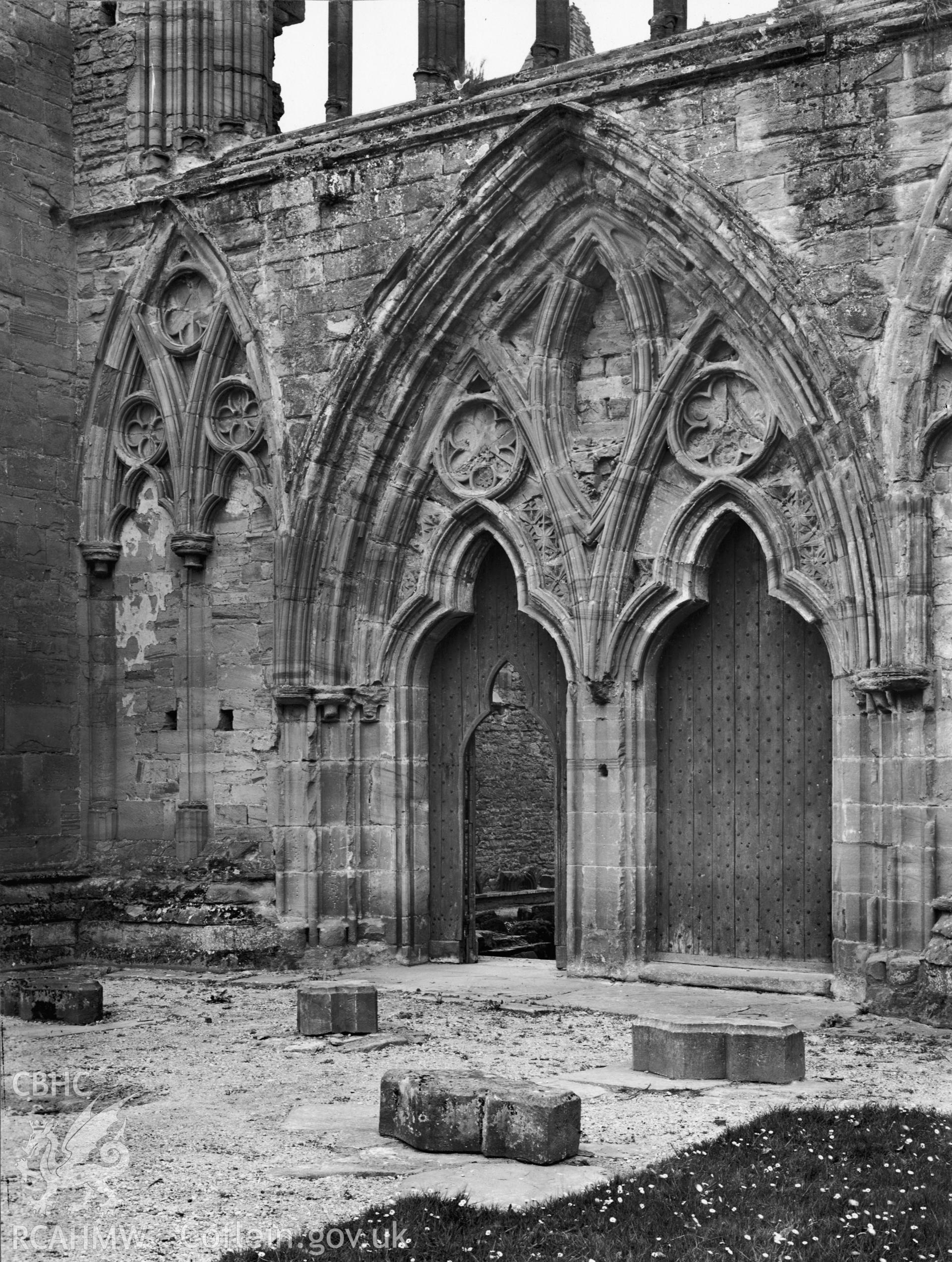 Black and white photo showing view of west doorway of Tintern Abbey taken circa 1905.