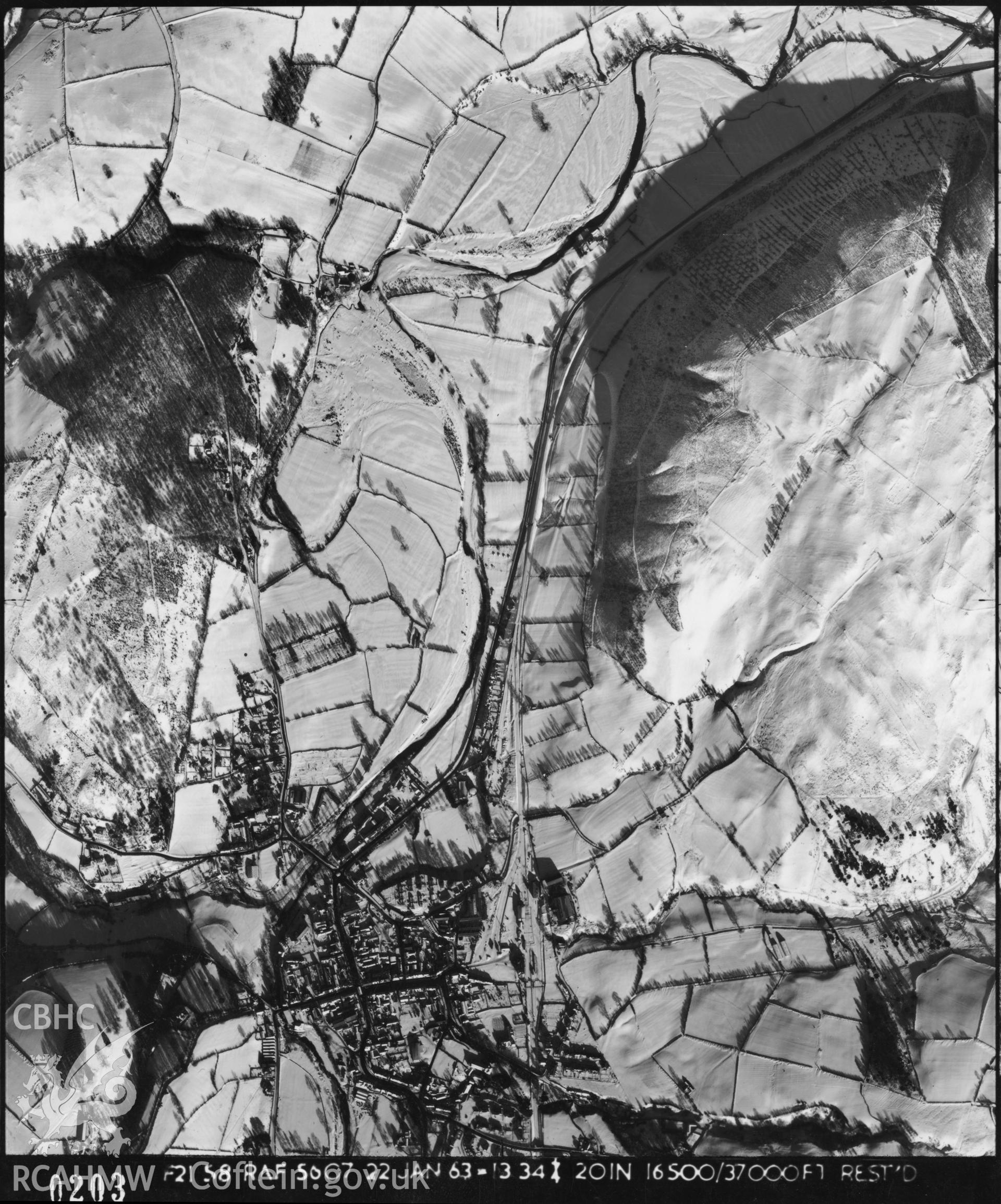 Black and white vertical aerial photograph taken by the RAF in 1963, centred on the area around Llanidloes..