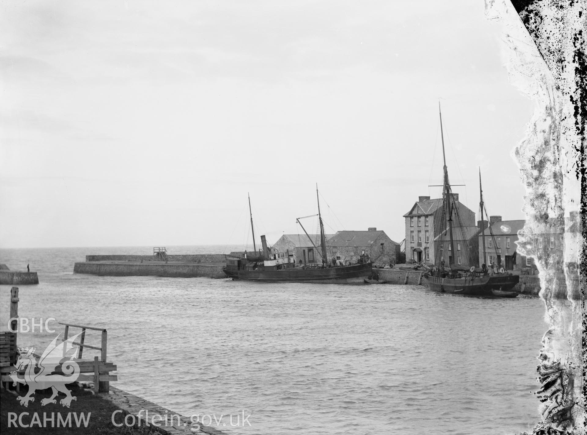 Black and white image dating from c.1910 showing the outer harbour in Aberaeron.