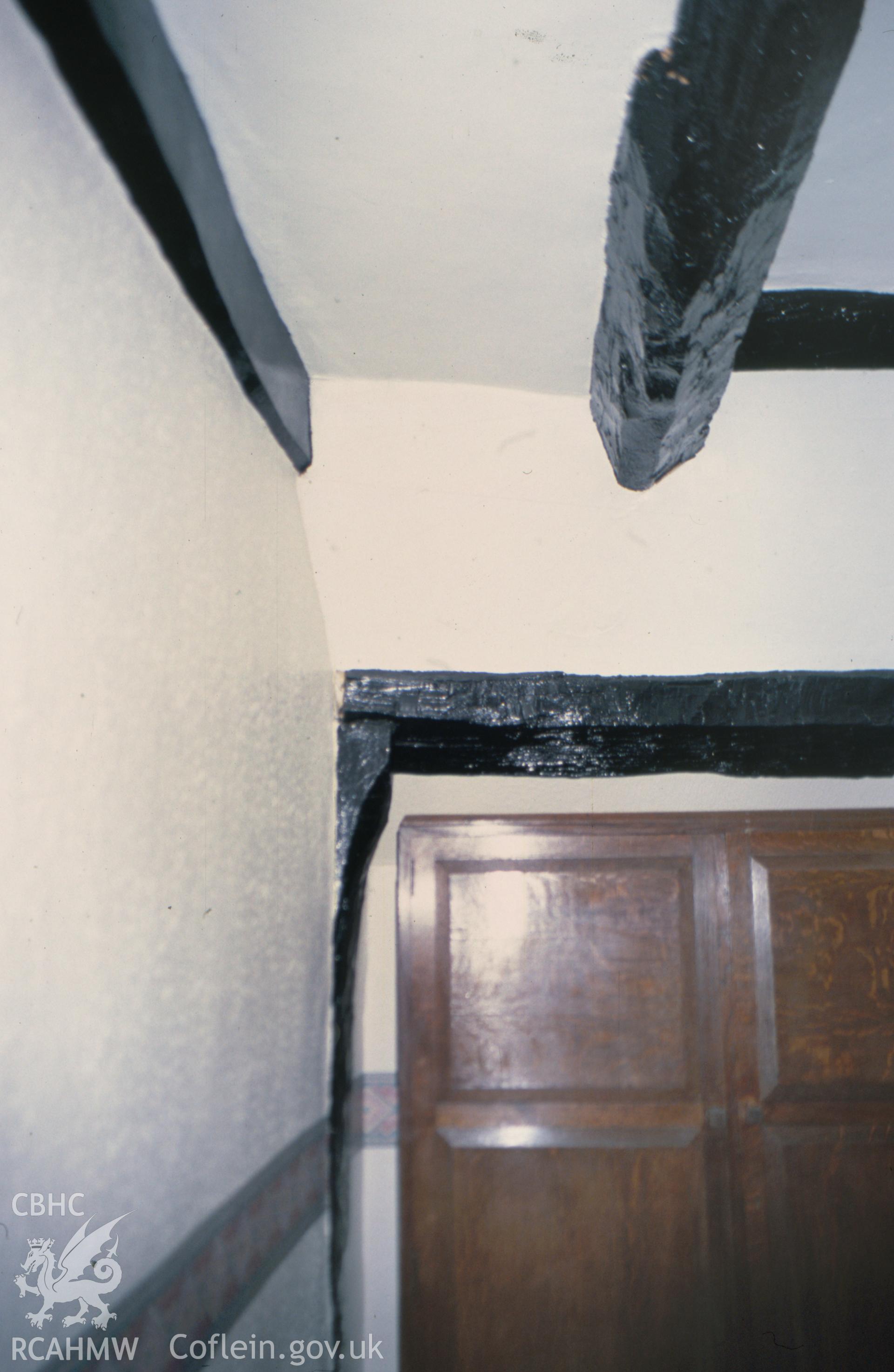 Interior view showing purlin in the ceiling of the attic passage roof.