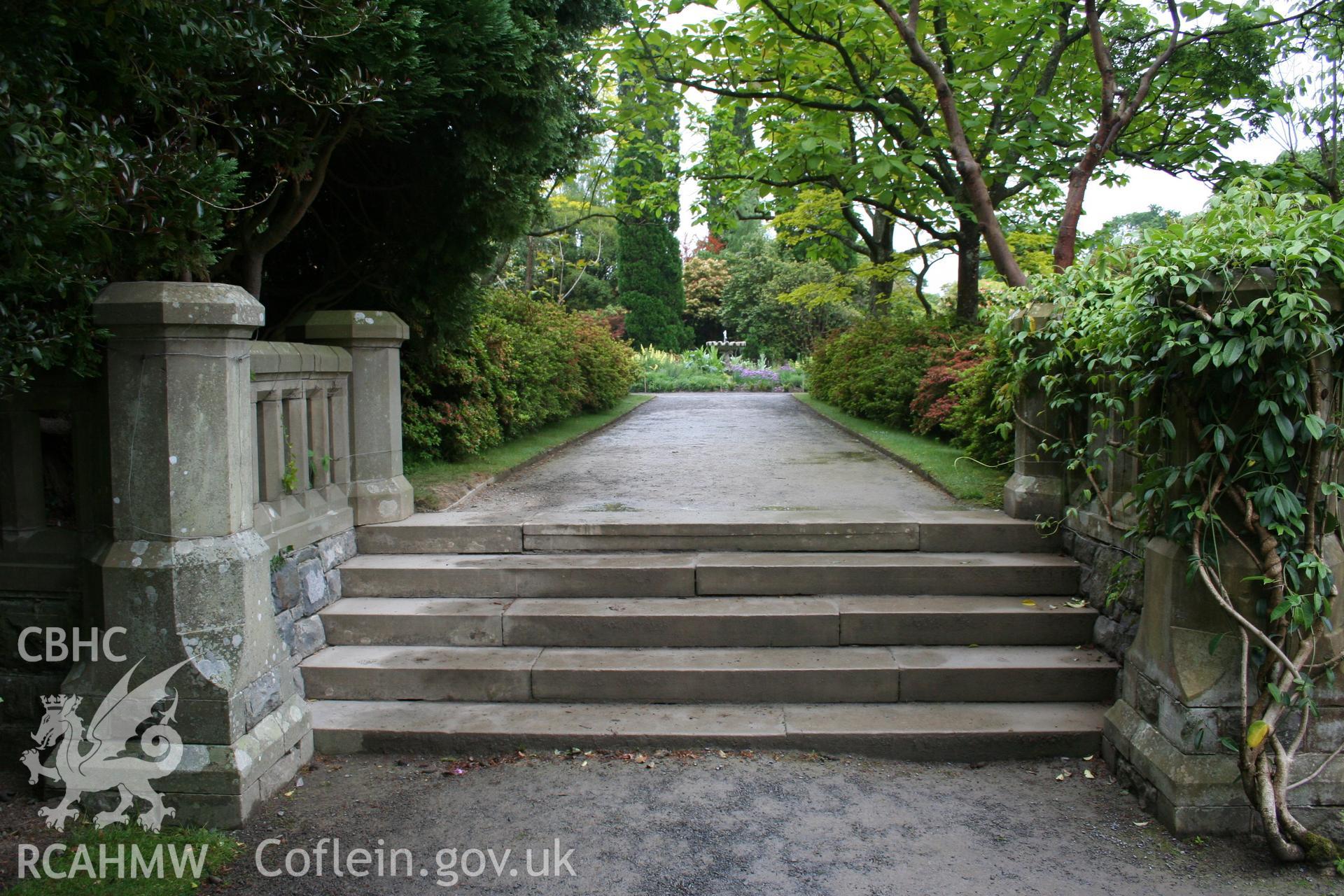 Ornamental steps from the house terrace up to the east garden, looking east.