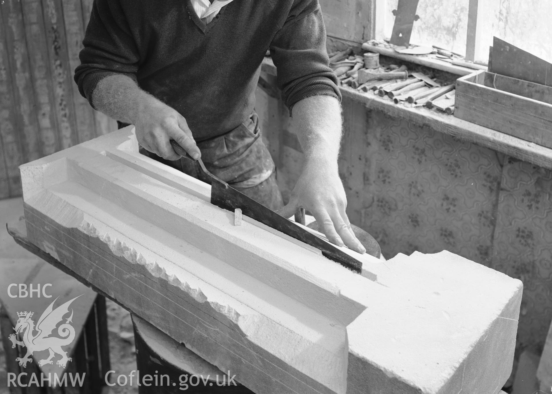 D.O.E photographs of Caerphilly Castle -  view of restorer cutting out glazing groove on transome.