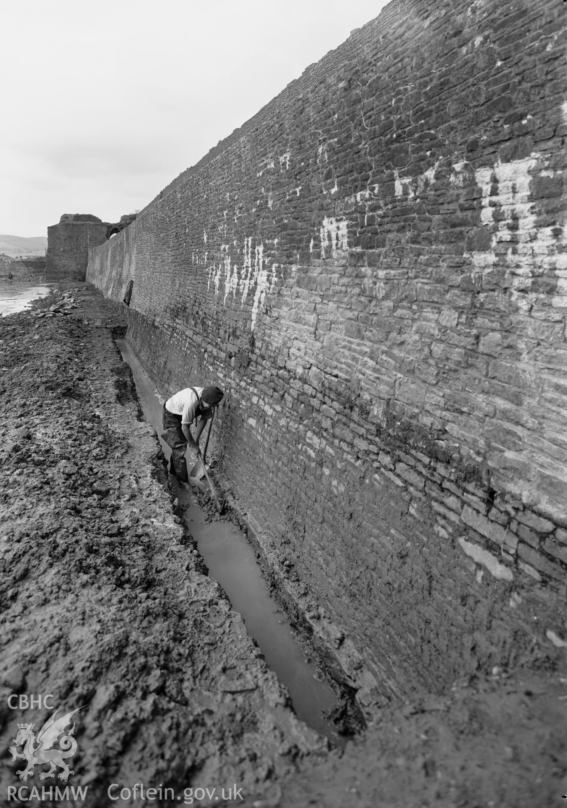 D.O.E photograph of Caerphilly Castle - trench along north platform, showing footing from the south.