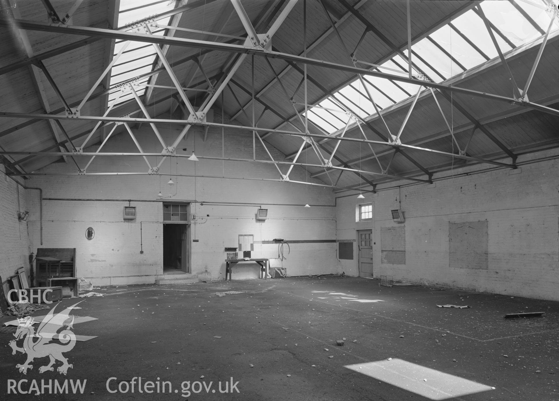 D.O.E photograph of Flint Gaol - inside Drill Hall, looking north west. In castle outer ward (since removed).