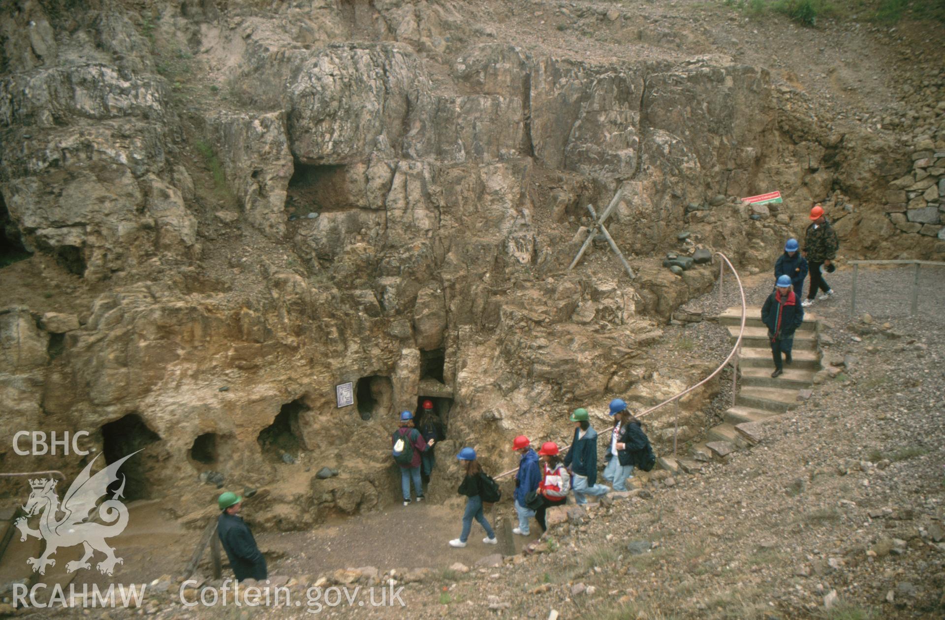 Digitized 35mm slide showing Great Orme Mines, tourists entering mines.