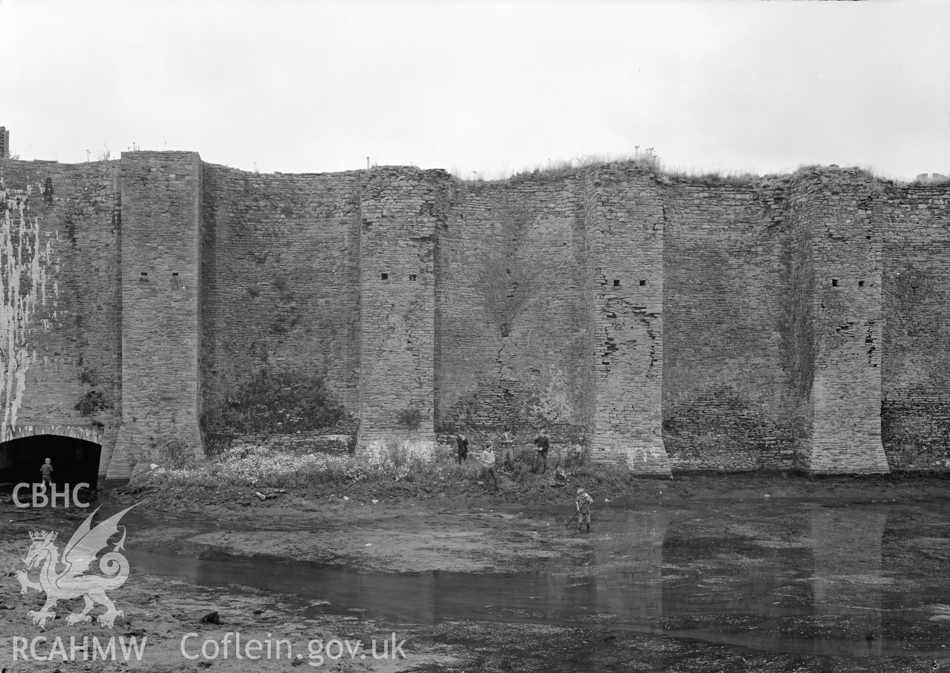 D.O.E photograph of Caerphilly Castle - south platform, section of east wall and culvert from east.