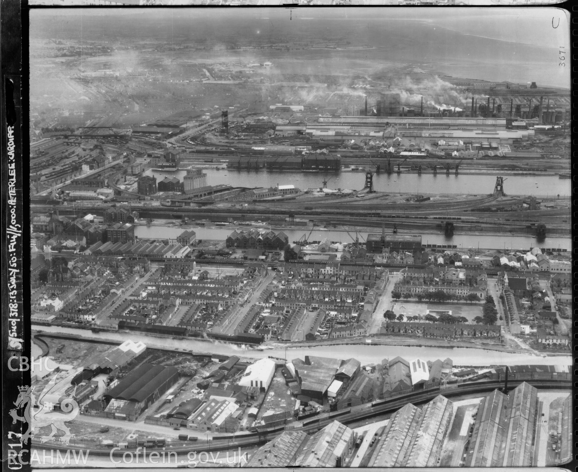 Black and white low level oblique aerial photograph taken by the RAF 1950 centred on Butetown, Cardiff .
