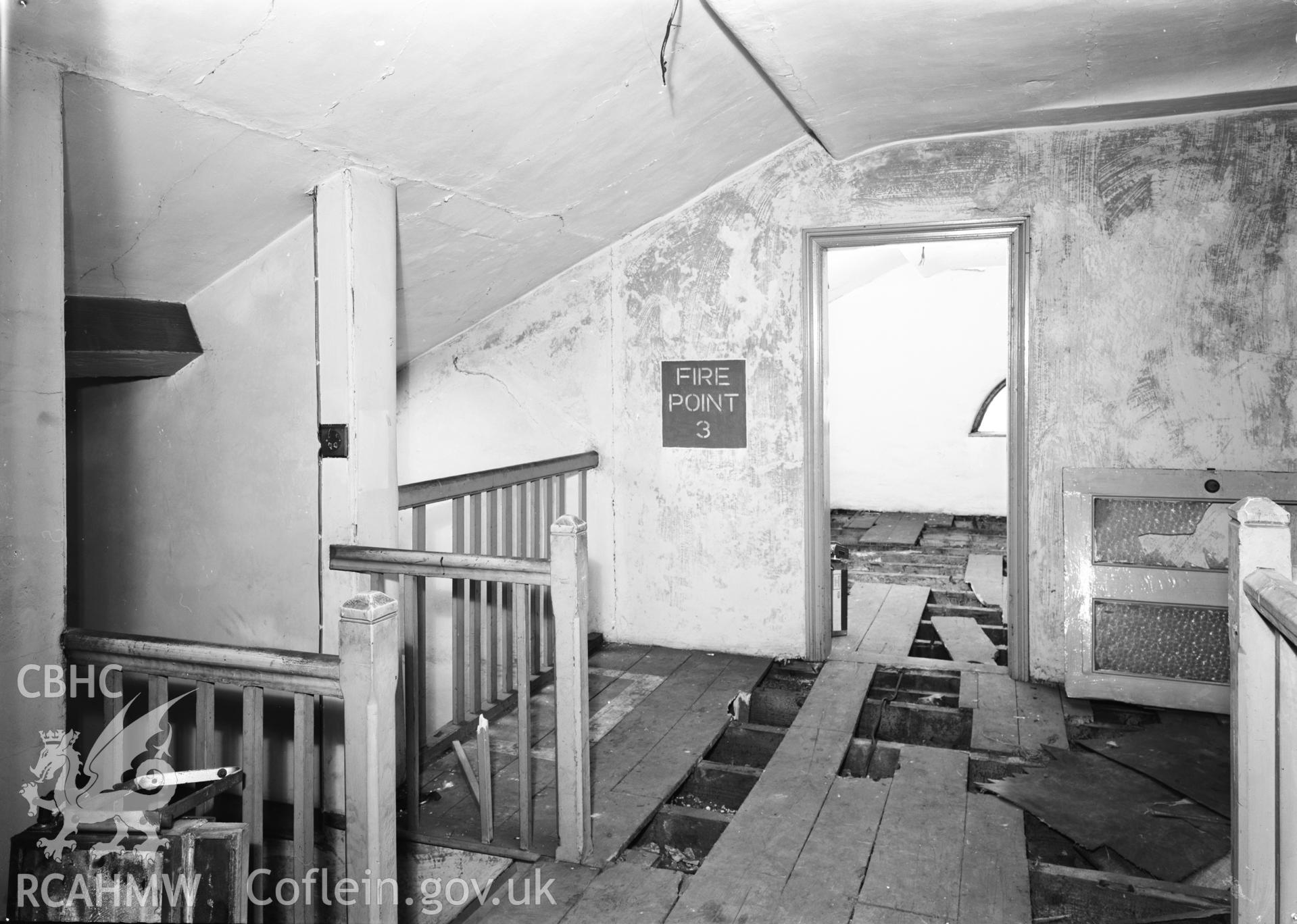 D.O.E photograph of Flint Gaol - top of attic stairs, looking south west. In castle outer ward (since removed).