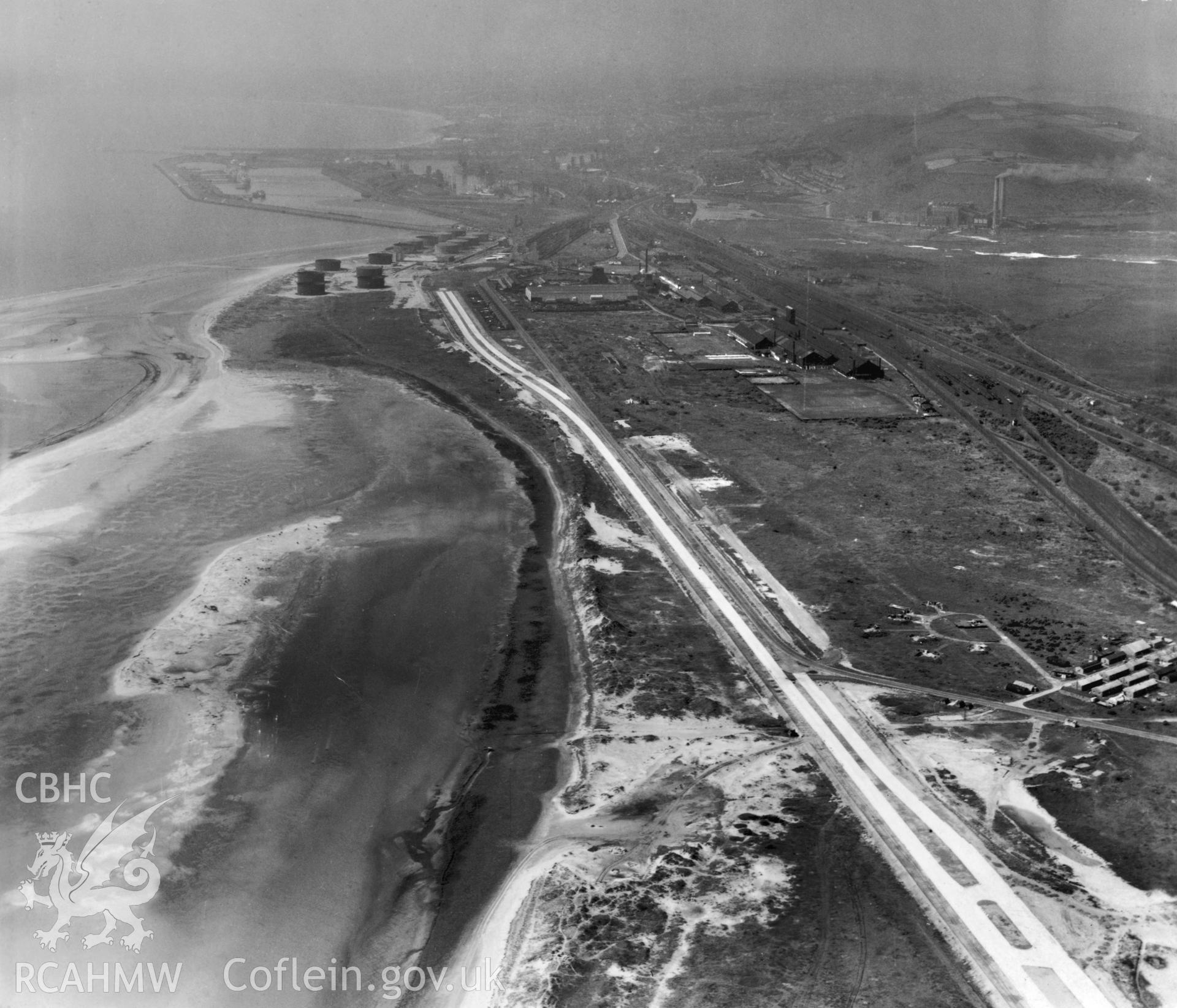 Black and white oblique aerial photograph looking west at Fabian Way during construction in 10.08.1948. Aerofilms album Swansea (W30).