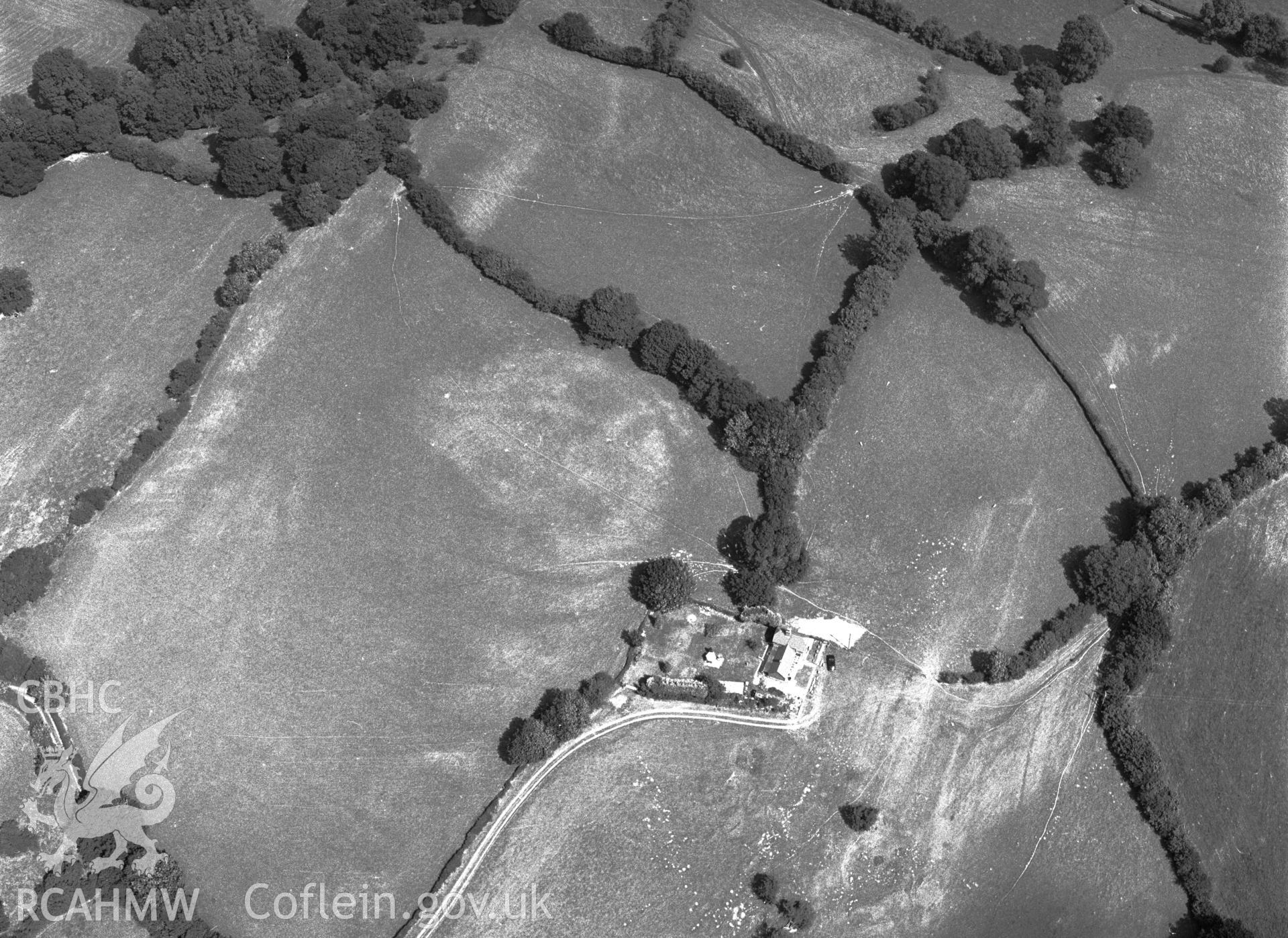 RCAHMW black and white oblique aerial photograph of possible cropmark enclosure NW of Penybryn, taken by C R Musson, 04/08/1996.