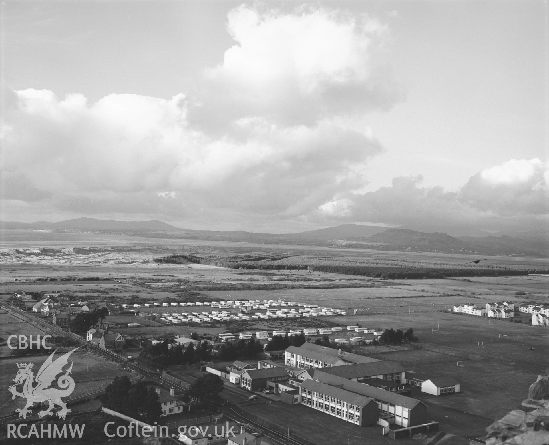 Photographic negative showing aerial oblique view of new housing at Harlech; collated by the former Central Office of Information.