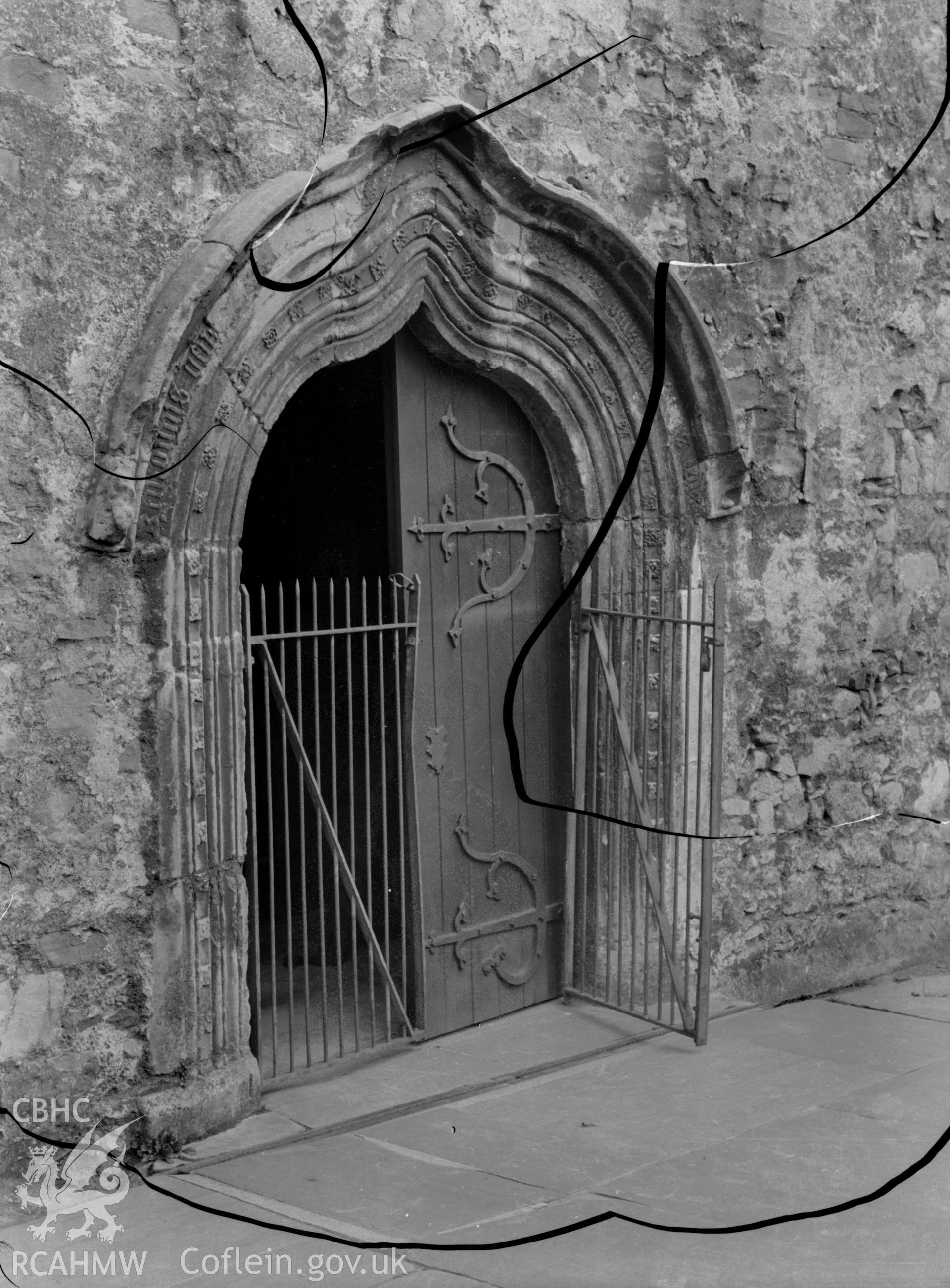 Black and white photo showing the doorway to St Mary's Church, Tenby.