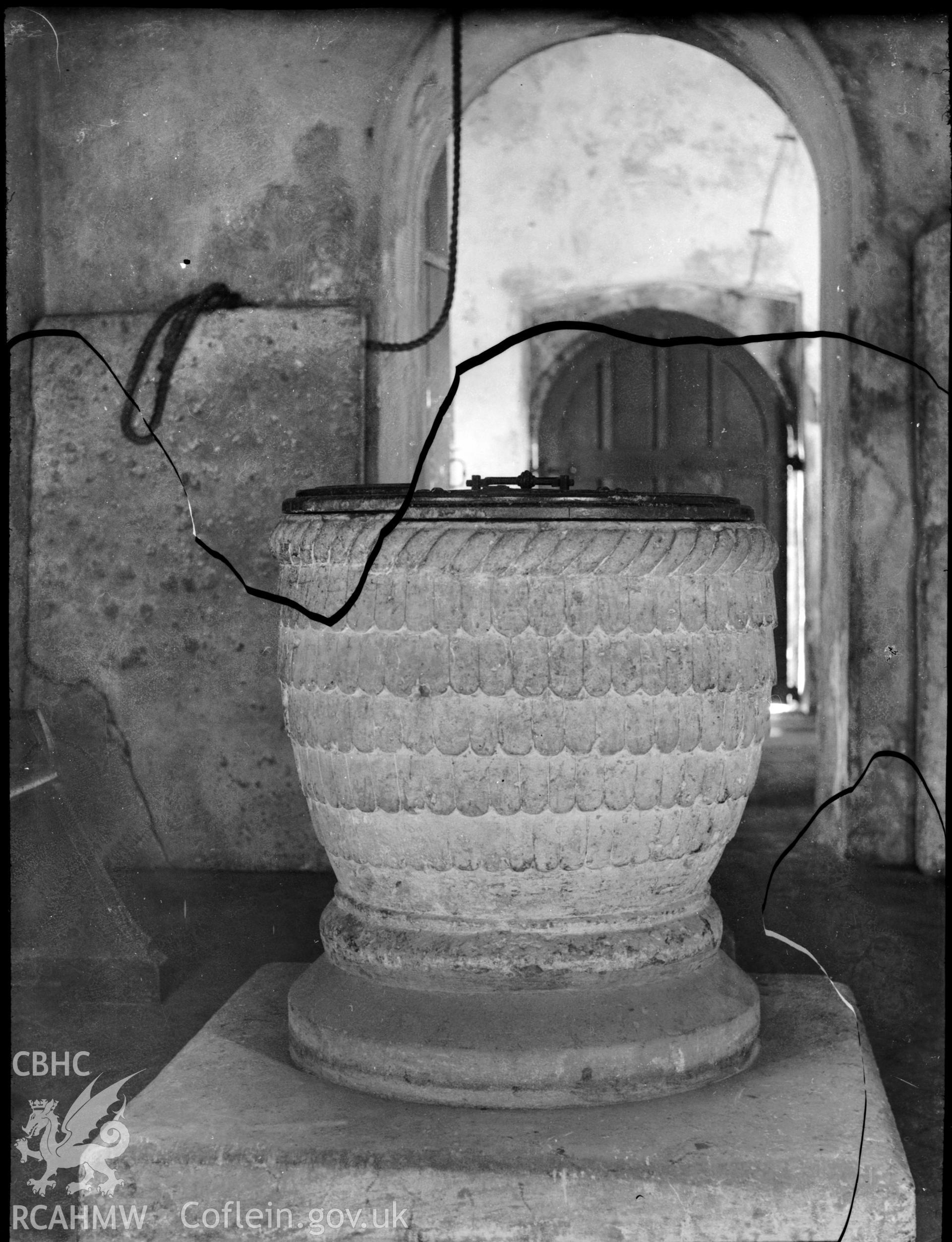 Black and white photo showing the font at Mawdlam Church.