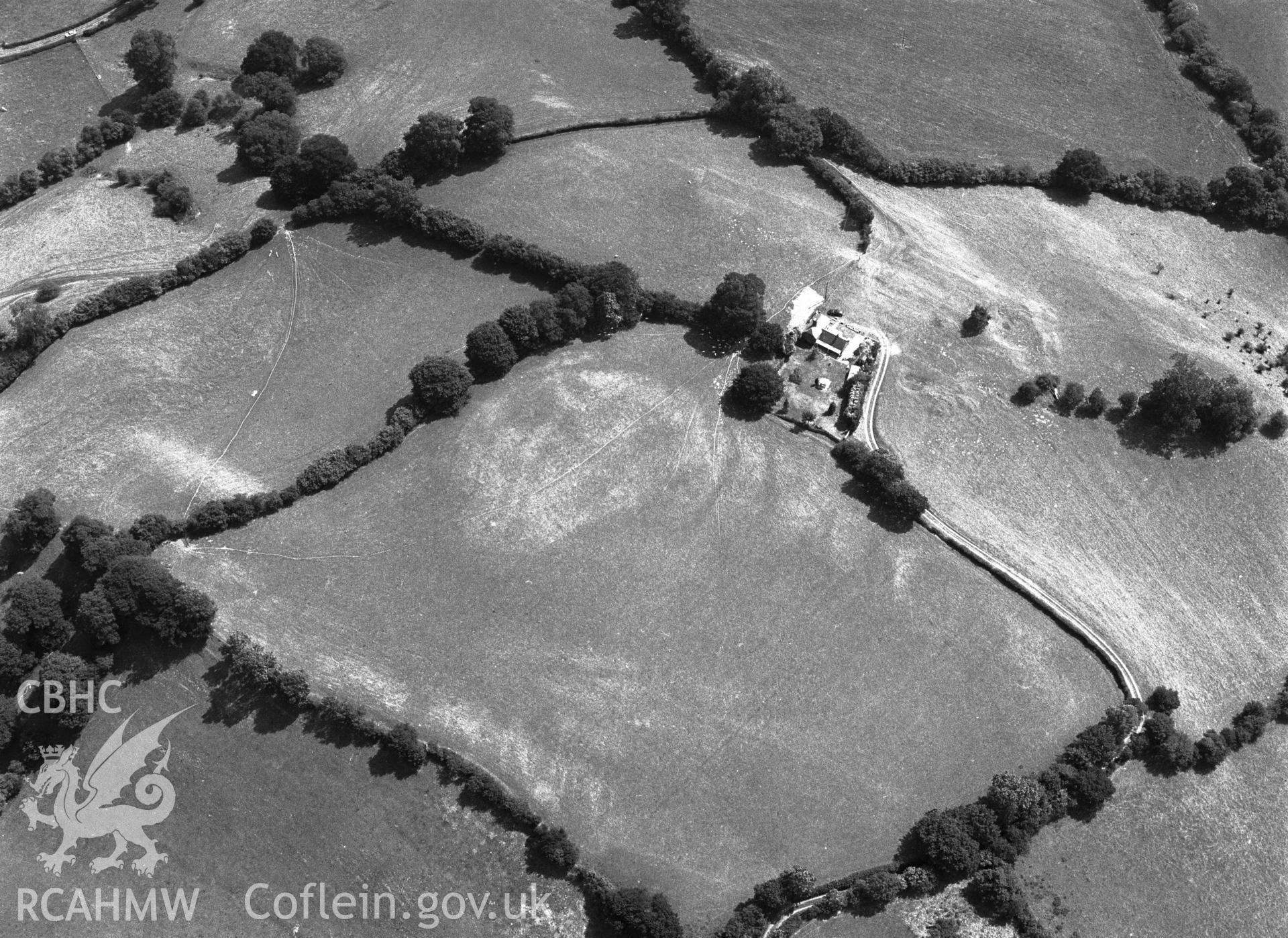 RCAHMW black and white oblique aerial photograph of possible cropmark enclosure NW of Penybryn, taken by C R Musson, 04/08/1996.