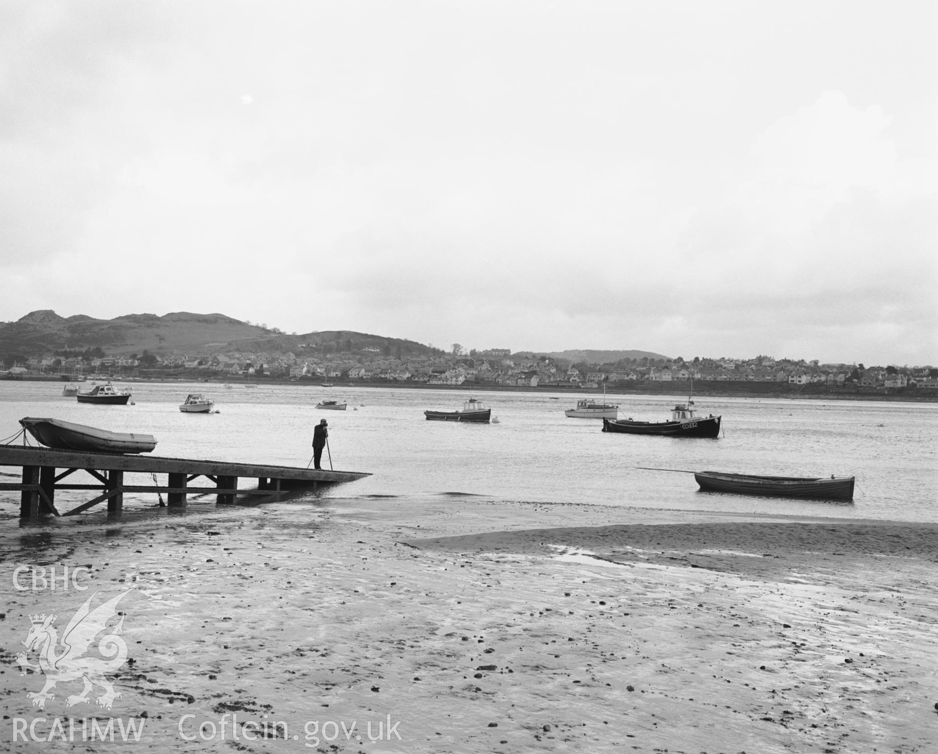 Photographic negative showing view of slipway and boats near Conwy Castle; collated by the former Central Office of Information.