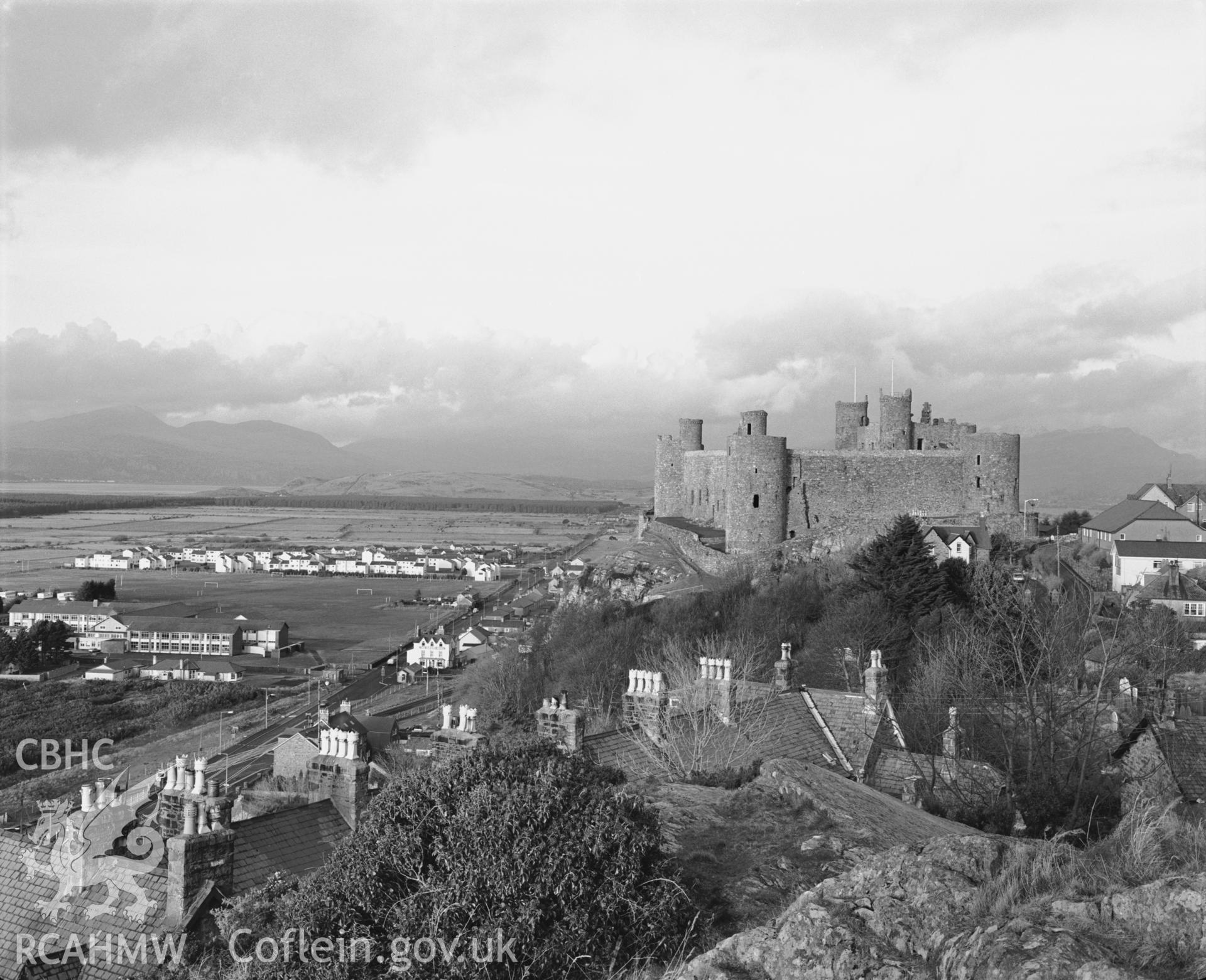 Photographic negative showing view of Harlech, including the castle; collated by the former Central Office of Information.