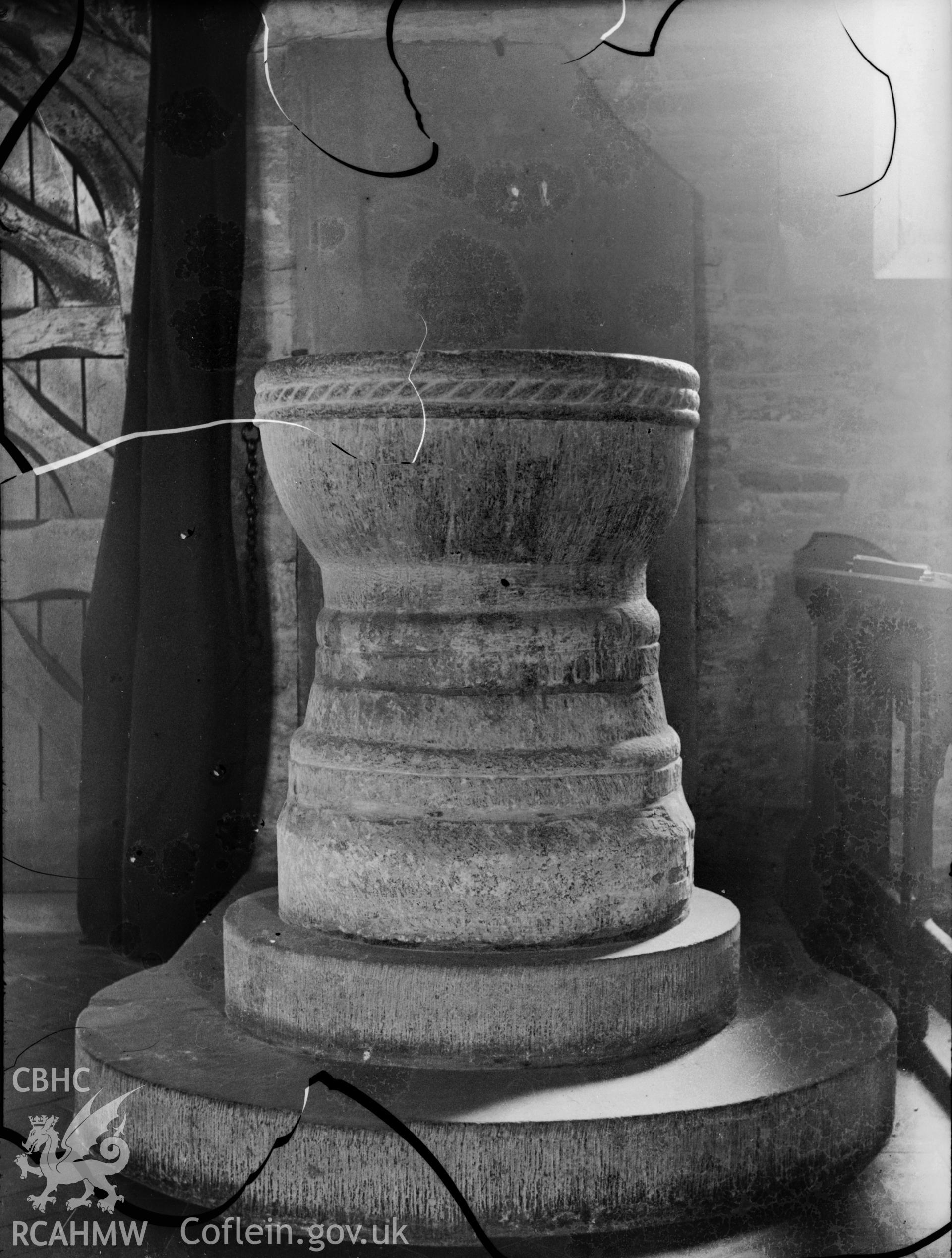 Black and white photo showing the font at Tal y Llyn Church.