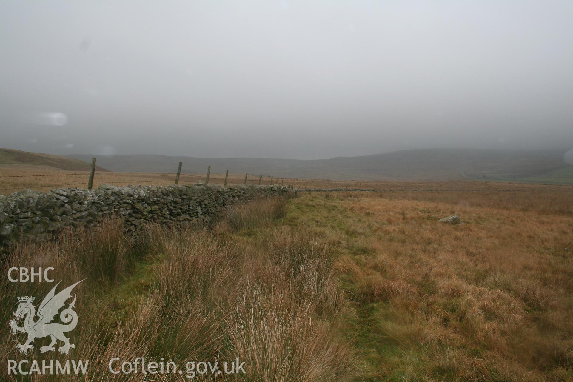 View along field wall at moorland edge with earlier head bank to its right in the picture.