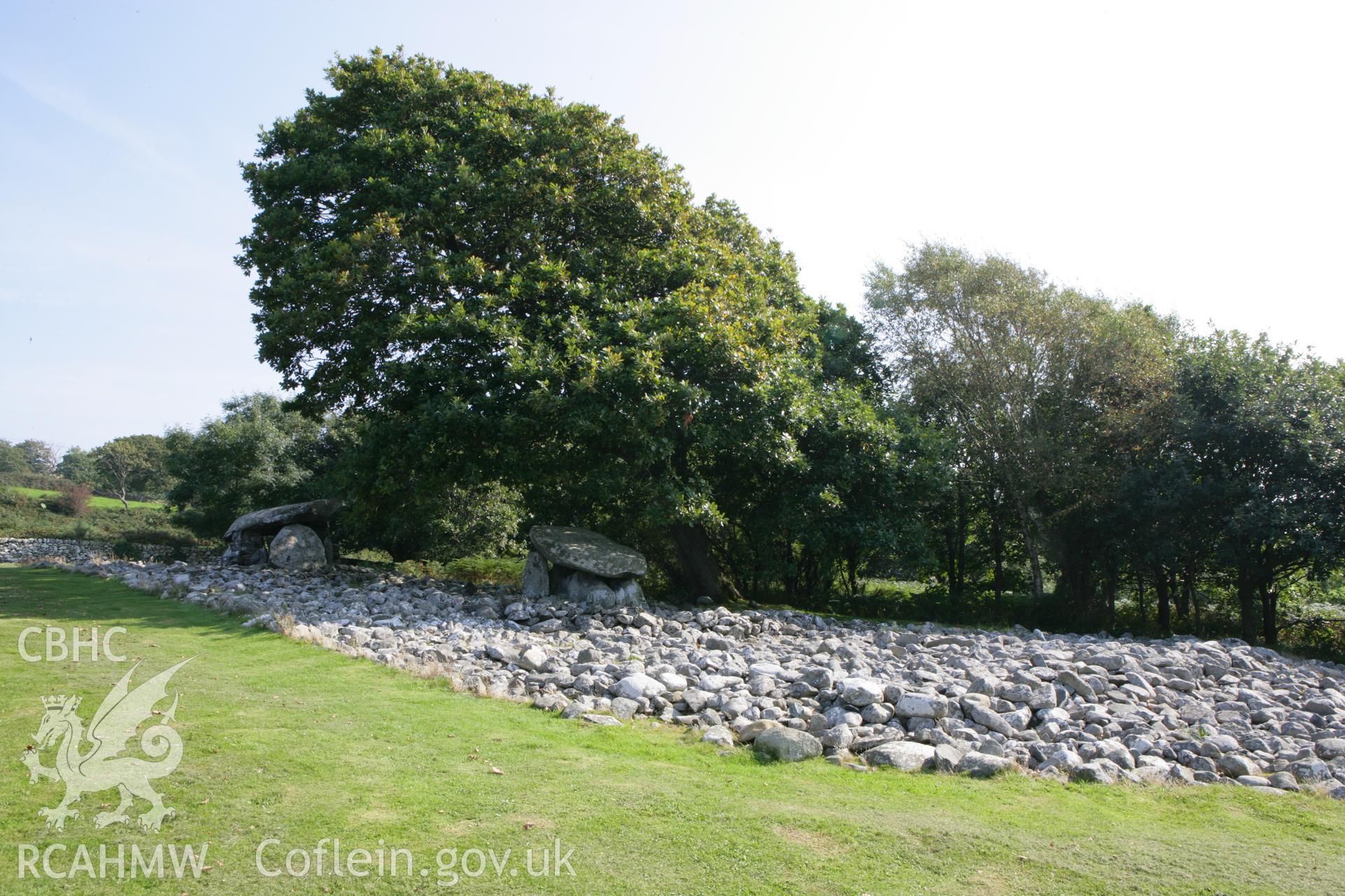 General view of tombs and cairn from west