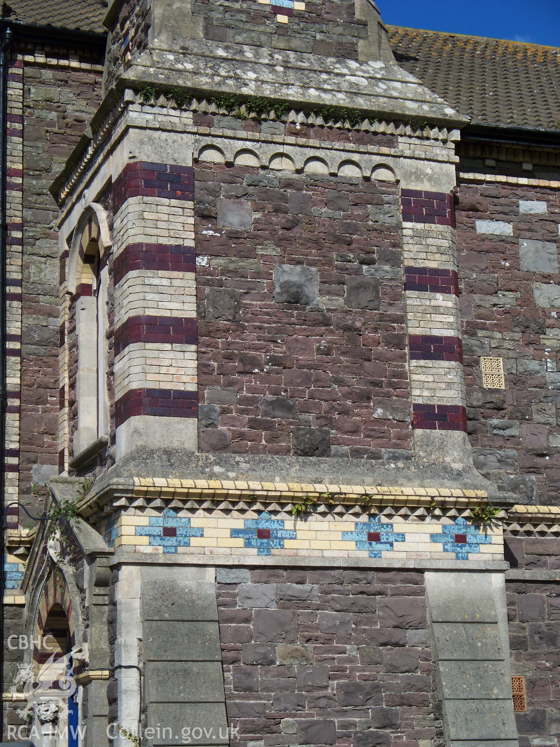 Polychrome brickwork on SW face of NW tower.