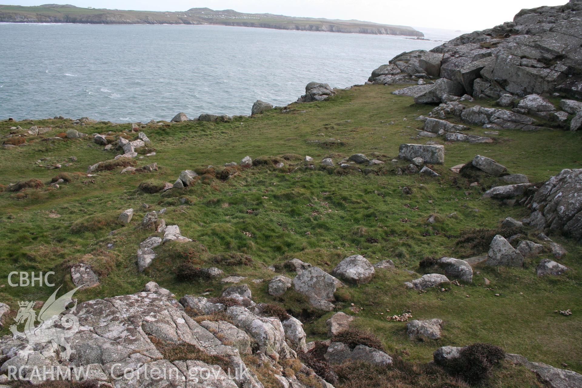 Clawdd y Milwyr promontory fort. Interior of fort showing north-western-most round house, looking south.