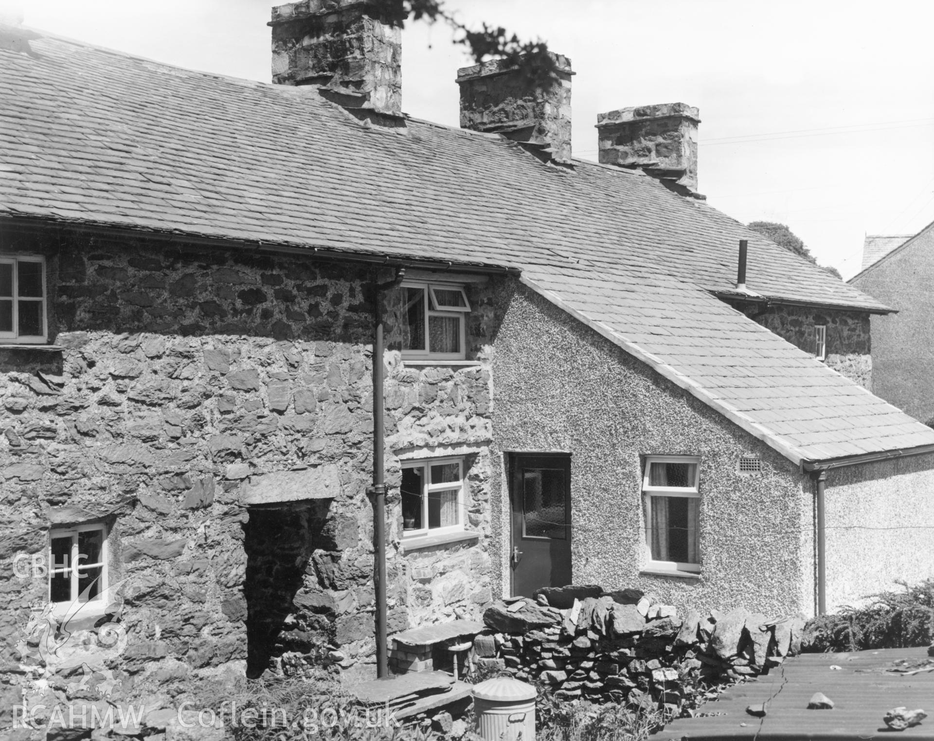 1 b/w print showing exterior of house on High Street, Ysbyty Ifan (showing new rear extension and new windows), used as an illustration of the Housing Improvement Grant scheme for exhibitions held at Ministry of Housing stands at agricultural shows (1960); collated by the former Central Office of Information.