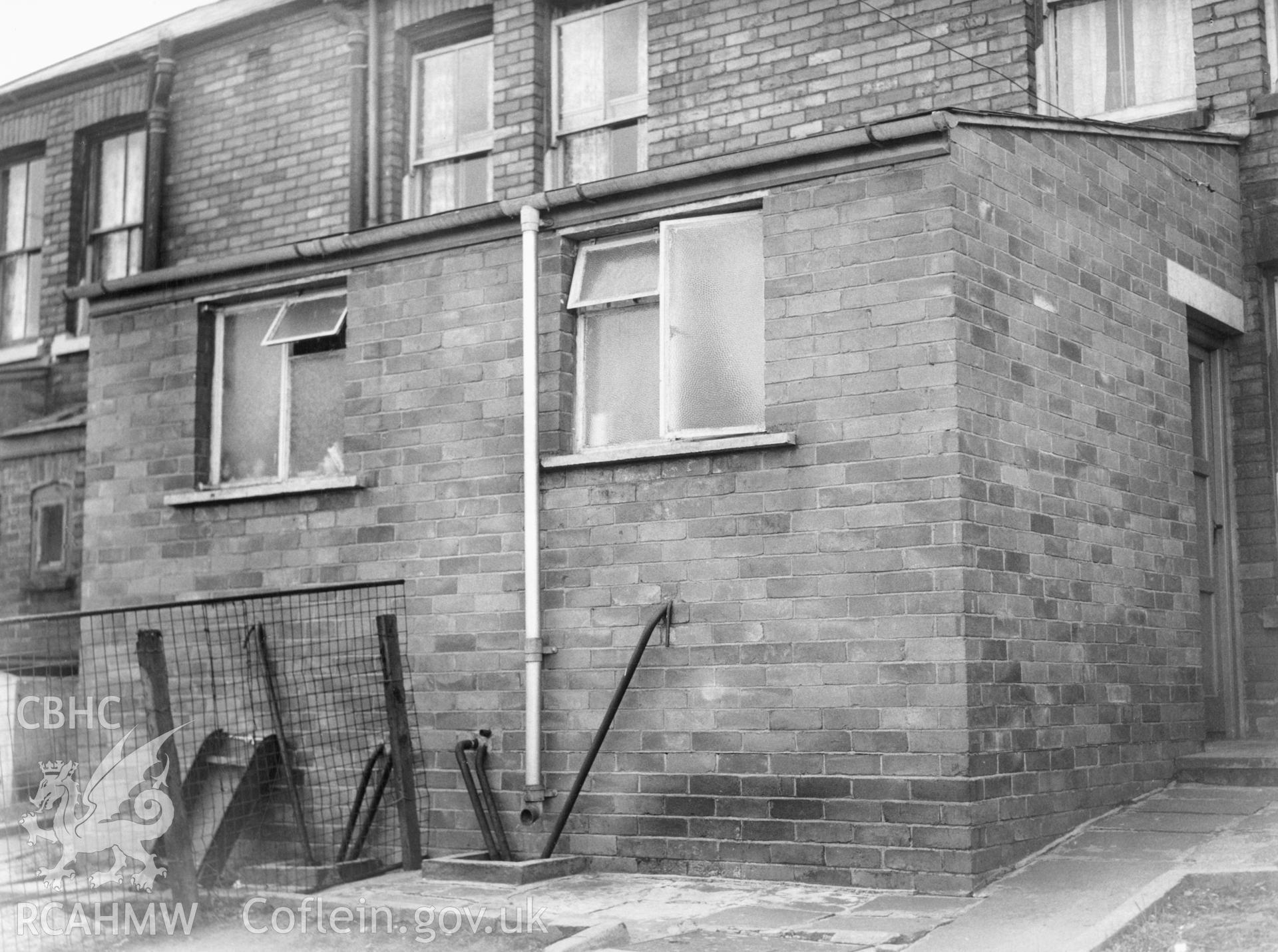 1 b/w print showing new rear extension on houses on Council Street, Ebbw Vale, used as an illustration of the Housing Improvement Grant scheme for exhibitions held at Ministry of Housing stands at agricultural shows (1960); collated by the former Central Office of Information.