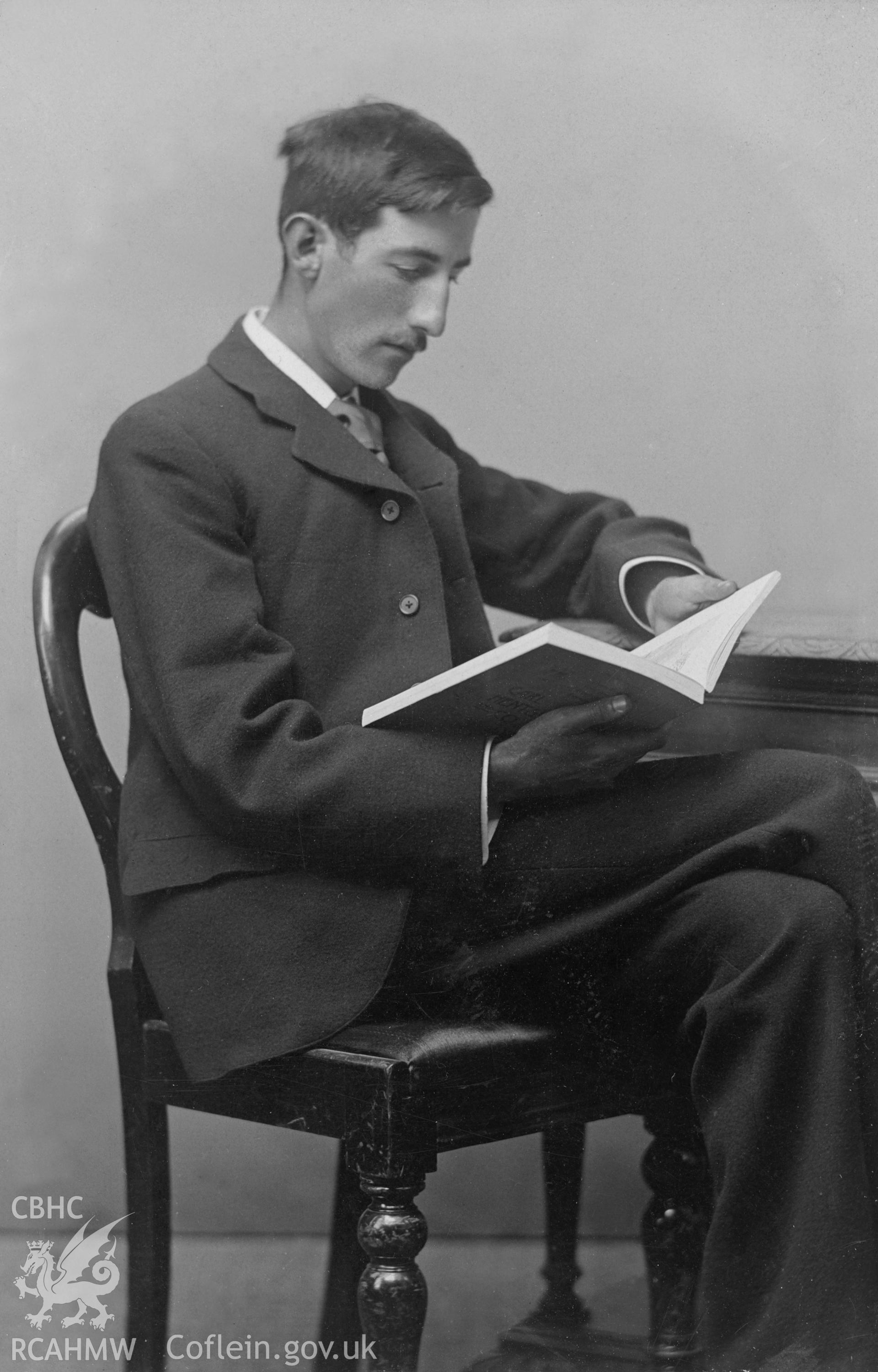 Photographic portrait of Herbert North, seated.