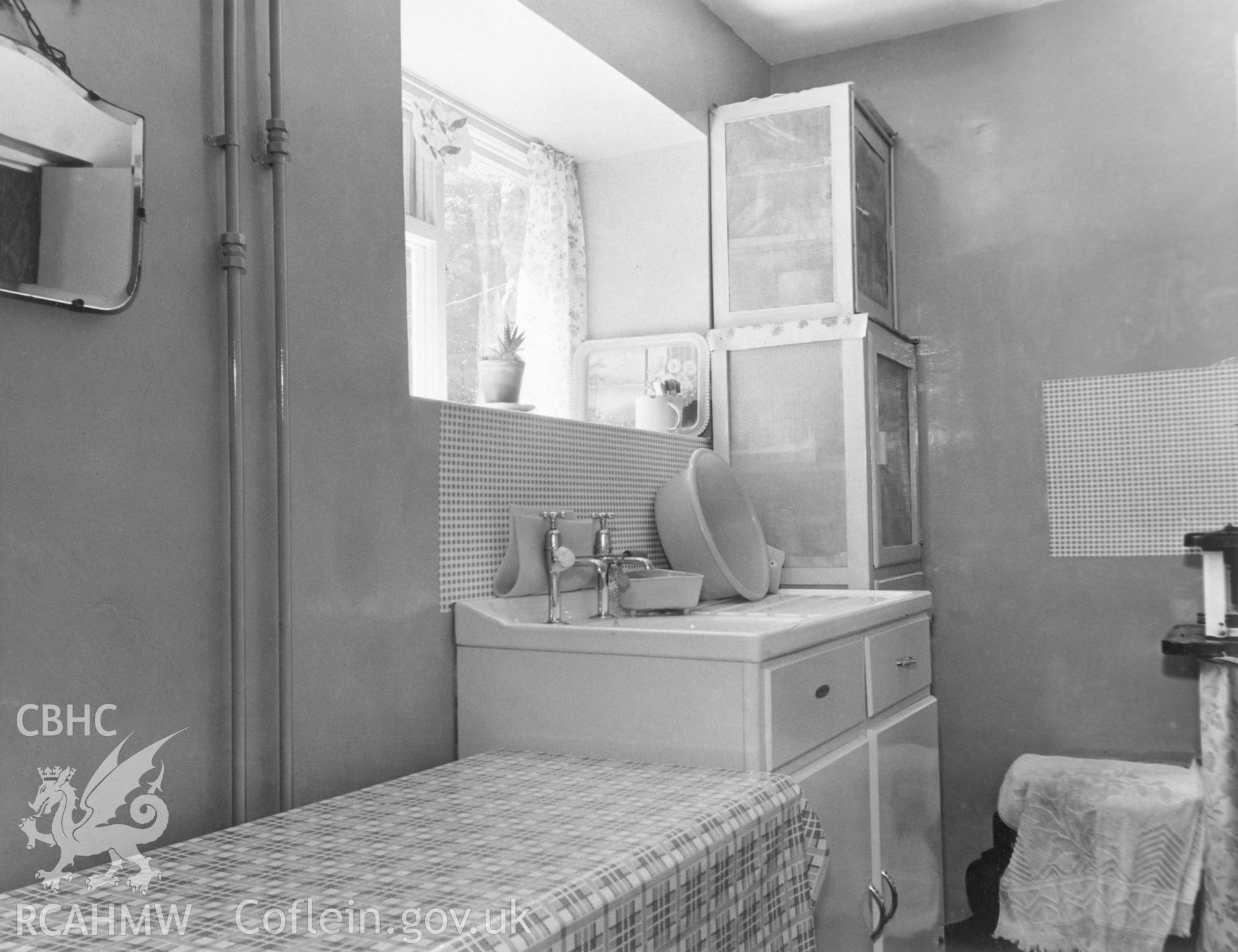 1 b/w print showing interior of house on High Street, Ysbyty Ifan (new sink unit), used as an illustration of the Housing Improvement Grant scheme for exhibitions held at Ministry of Housing stands at agricultural shows (1960); collated by the former Central Office of Information.
