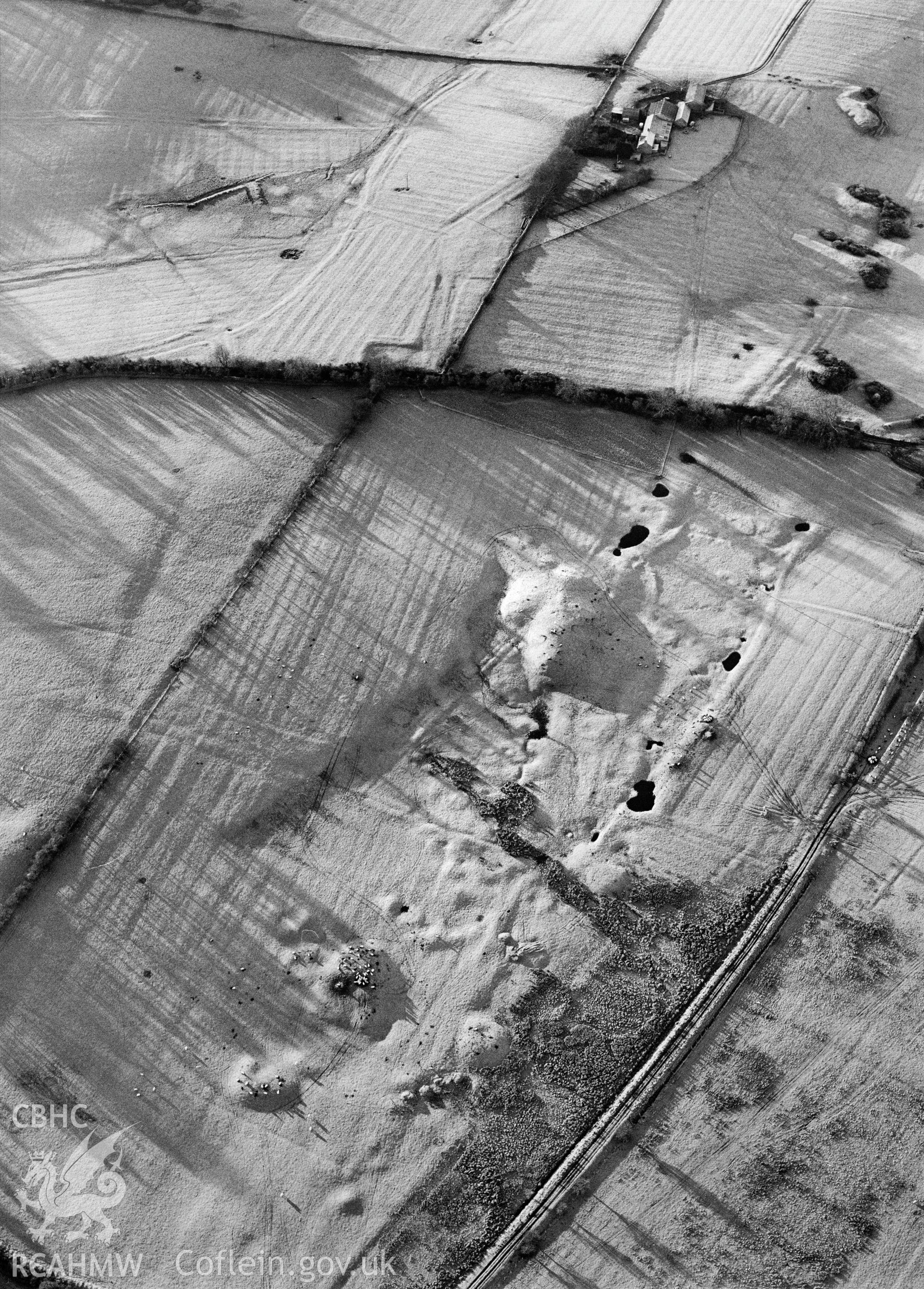 RCAHMW Black and white oblique aerial photograph of Ty-mawr Coal Workings, Llanfihangel Ysgeifiog, taken on 10/01/1999 by Toby Driver
