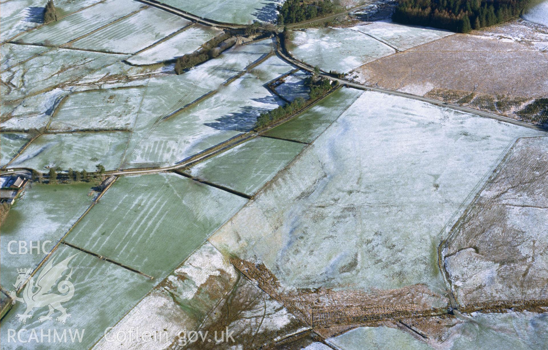 RCAHMW colour slide aerial photograph of Cwm Nant marching camp, St Harmon, under snow. Taken by Toby Driver on 31/01/2003